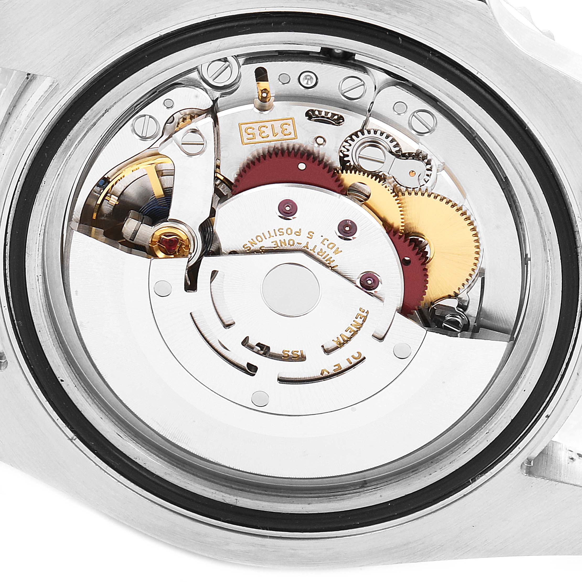 This image shows an angled view of the open case back, revealing the movement mechanism of a Rolex Submariner 116610LV Men
s Stainless Steel Green Dial 116610LV Men
s Stainless Steel Green Dial watch.