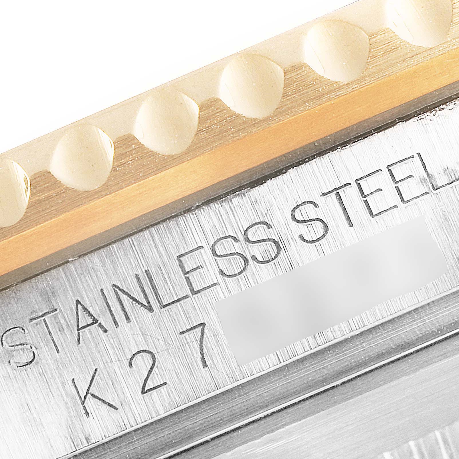 This close-up image shows the side and part of the bezel of a Rolex Submariner 16613 Men
s Steel and Gold (two tone) Blue Dial 16613 Men
s Steel and Gold (two tone) Blue Dial, highlighting the stainless steel material.