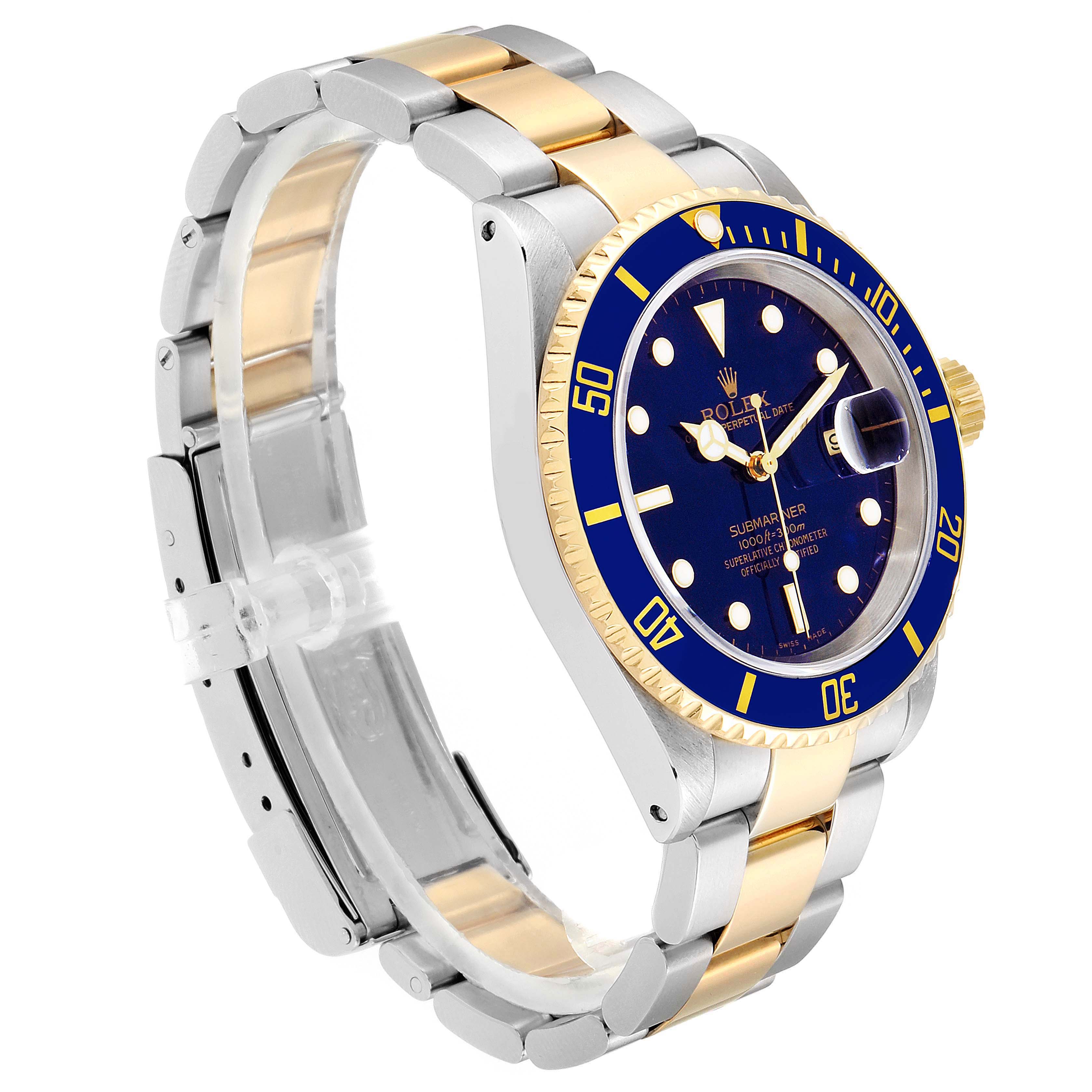 The Rolex Submariner 16613 Men
s Steel and Gold (two tone) Blue Dial 16613 Men
s Steel and Gold (two tone) Blue Dial watch is shown at an angle, displaying its blue dial, bezel, and two-tone metal bracelet.