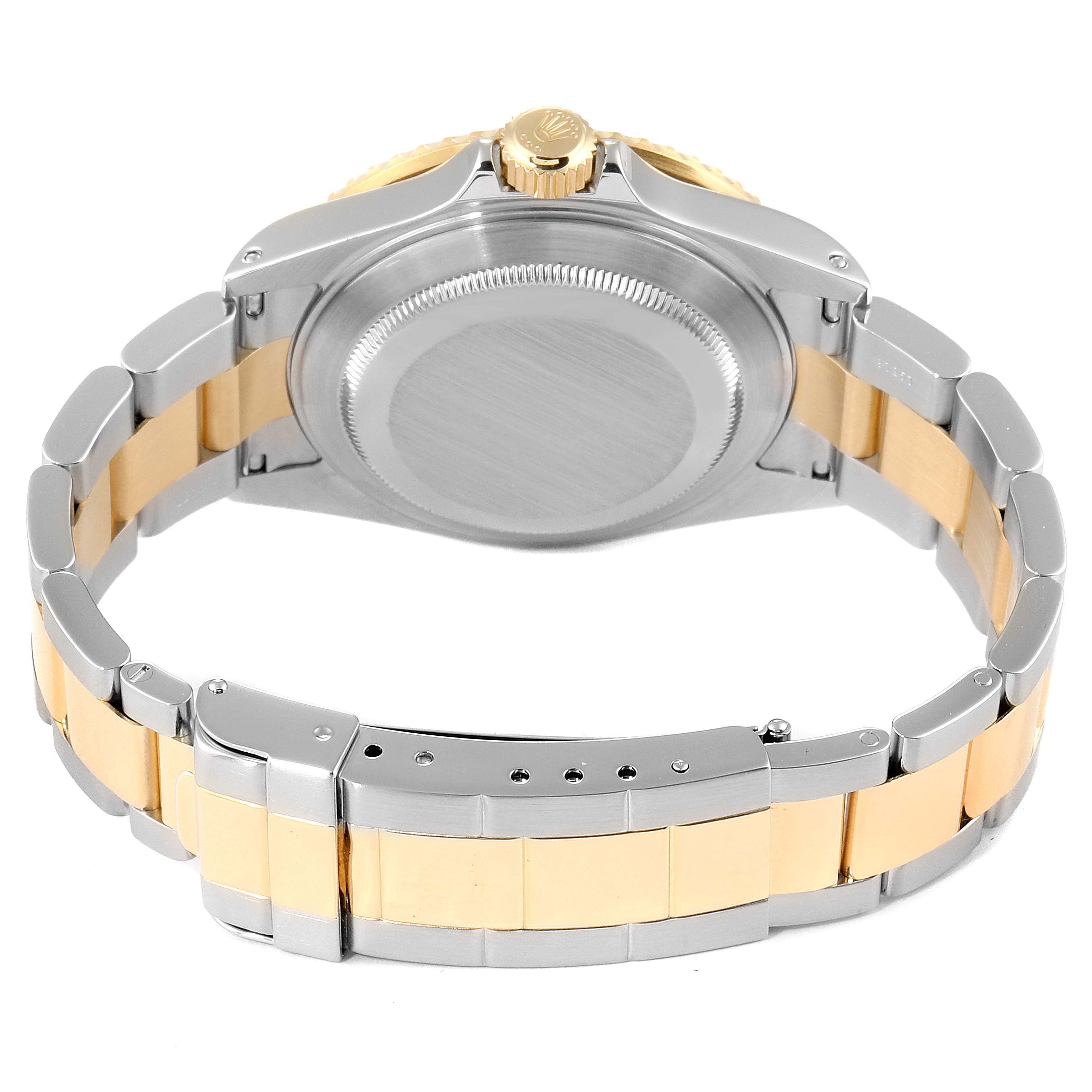 The image shows the back view of the Rolex Submariner 16613 Men
s Steel and Gold (two tone) Blue Dial 16613 Men
s Steel and Gold (two tone) Blue Dial watch, highlighting the case back and two-tone bracelet.