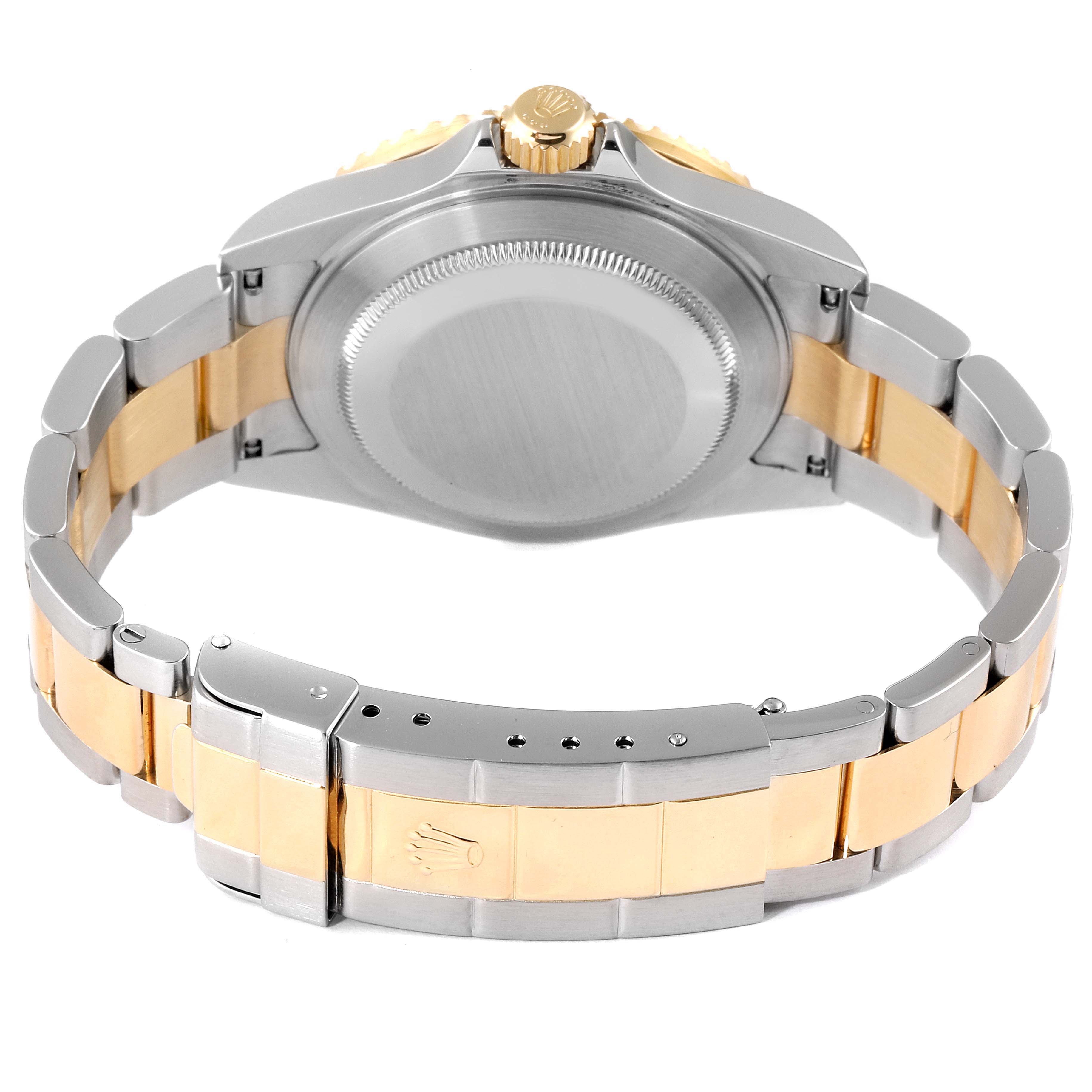 The image shows the back view of a Rolex Submariner 16613 Men
s Steel and Gold (two tone) Champagne Dial 16613 Men
s Steel and Gold (two tone) Champagne Dial watch, including the case back and two-tone metal bracelet with a clasp.