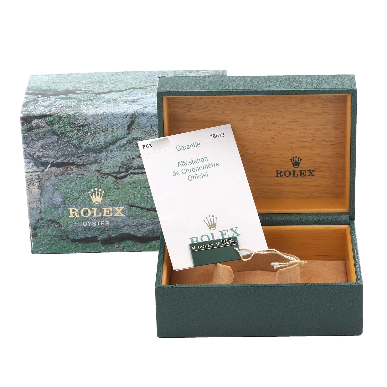 The image shows an open Rolex Submariner 16613 Men's Steel and Gold (two tone) Black Dial 16613 Men's Steel and Gold (two tone) Black Dial box with a booklet and watch cushion.