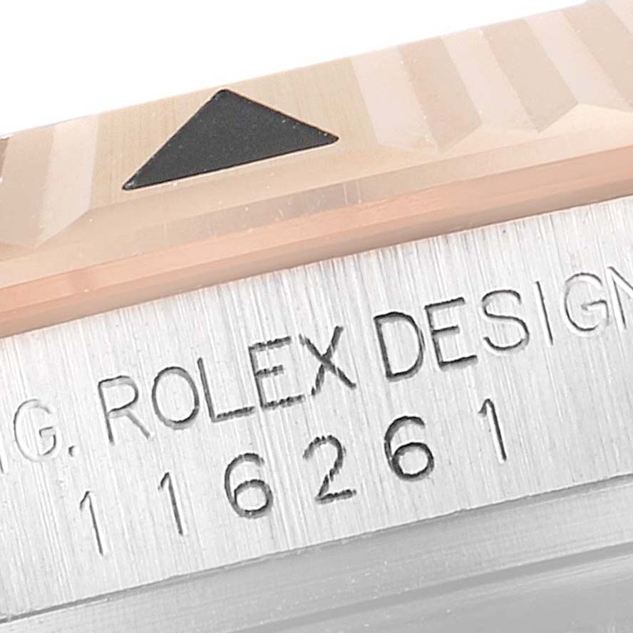 The image shows a close-up of the bezel and engraved serial number on a Rolex Turn-o-Graph 116261 Men
s Steel and Gold (two tone) White Dial 116261 Men
s Steel and Gold (two tone) White Dial watch.