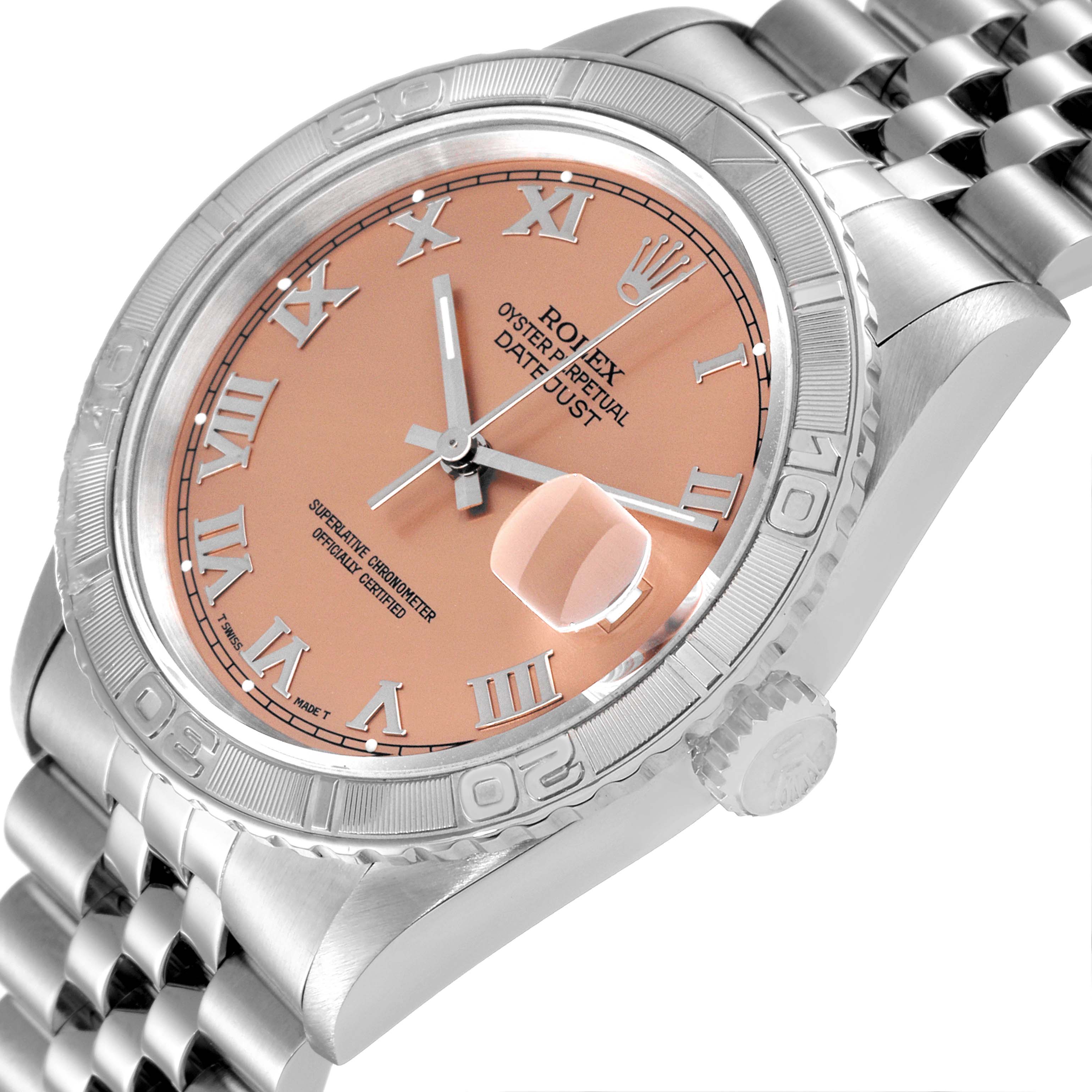 The image shows a close-up of the face and bezel of a Rolex Turn-o-Graph 16264 Men
s Stainless Steel Pink Dial 16264 Men
s Stainless Steel Pink Dial watch from an oblique angle.