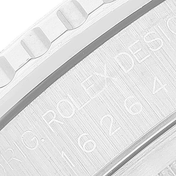 The image shows a close-up of the bezel and case side of a Rolex Turn-o-Graph 16264 Men
s Stainless Steel Pink Dial 16264 Men
s Stainless Steel Pink Dial watch, displaying part of the "ROLEX DESIGN" engraving.