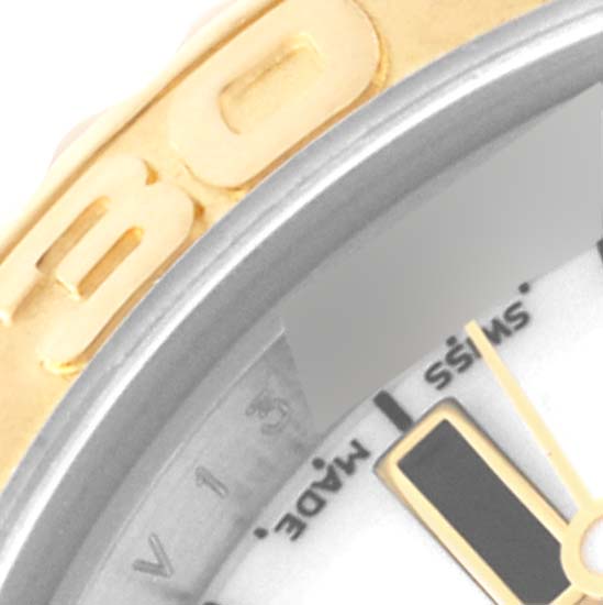 The image shows a close-up of the bezel and part of the dial of a Rolex Yacht-Master 169623 Women
s Steel and Gold (two tone) White Dial 169623 Women
s Steel and Gold (two tone) White Dial watch, highlighting the "SWISS MADE" text.
