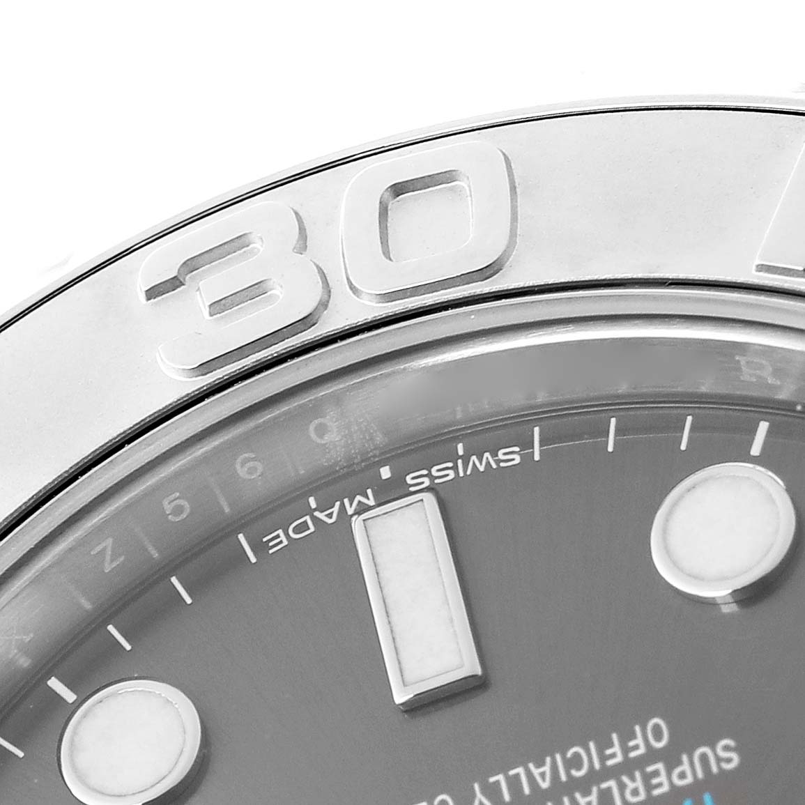 The image shows a close-up of the Rolex Yacht-Master M268622-0002 Men's Stainless Steel Grey Dial M268622-0002 Men's Stainless Steel Grey Dial's bezel and part of the dial from an angled perspective.