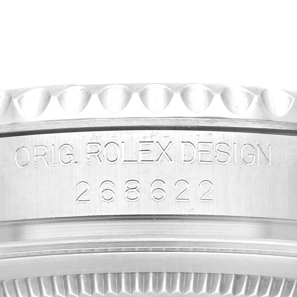 The image shows a close-up of the side engraving on the bezel of a Rolex Yacht-Master M268622-0002 Men's Stainless Steel Grey Dial M268622-0002 Men's Stainless Steel Grey Dial watch.
