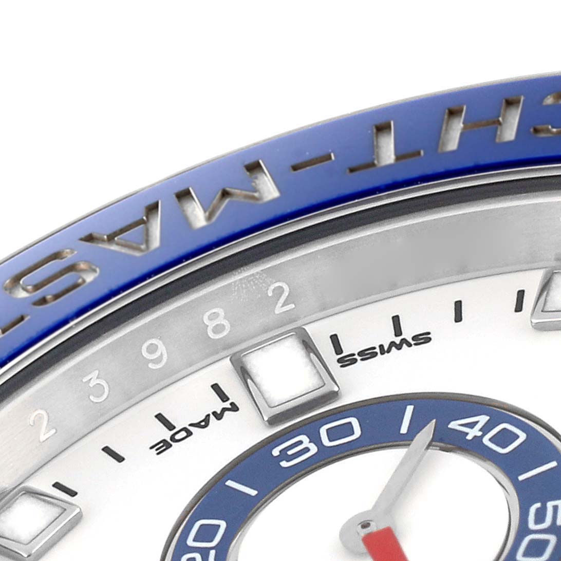 The image shows a close-up of the bezel and part of the dial of a Rolex Yacht-Master 116680 Men's Stainless Steel White Dial 116680 Men's Stainless Steel White Dial watch.