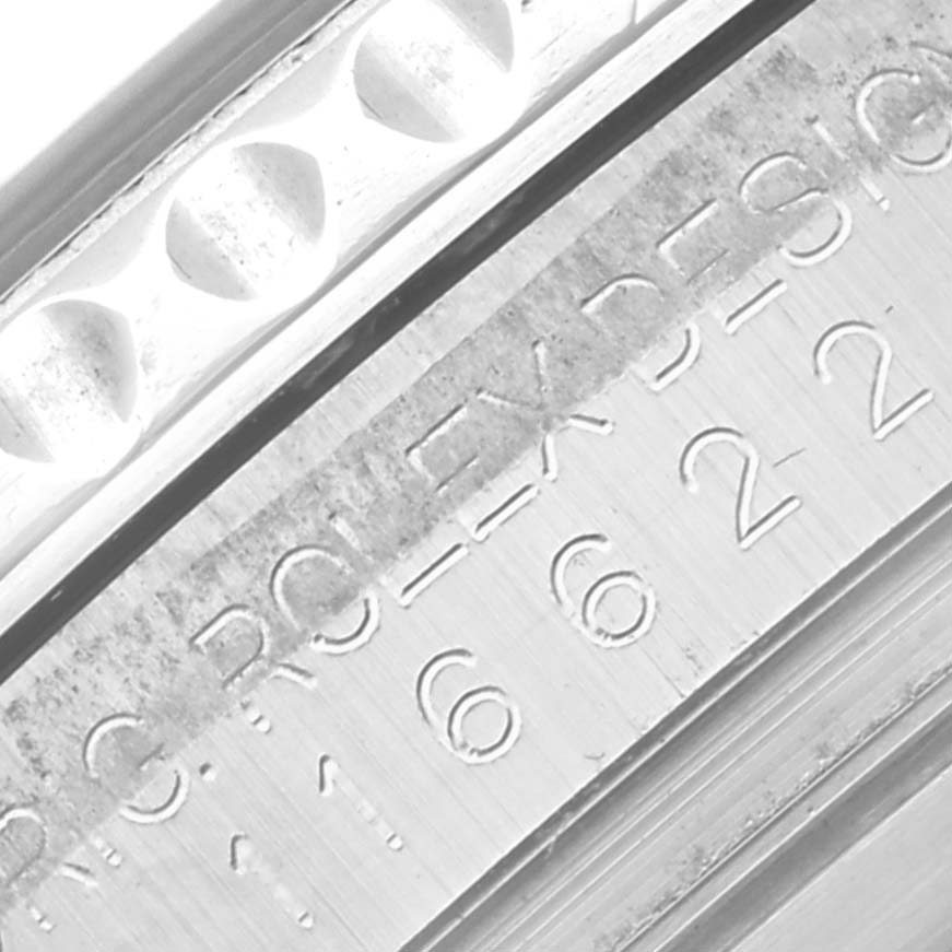 The image shows a close-up of the side of a Rolex Yacht-Master 116622 Men's Stainless Steel Blue Dial 116622 Men's Stainless Steel Blue Dial, focusing on the bezel and part of the engraved text.