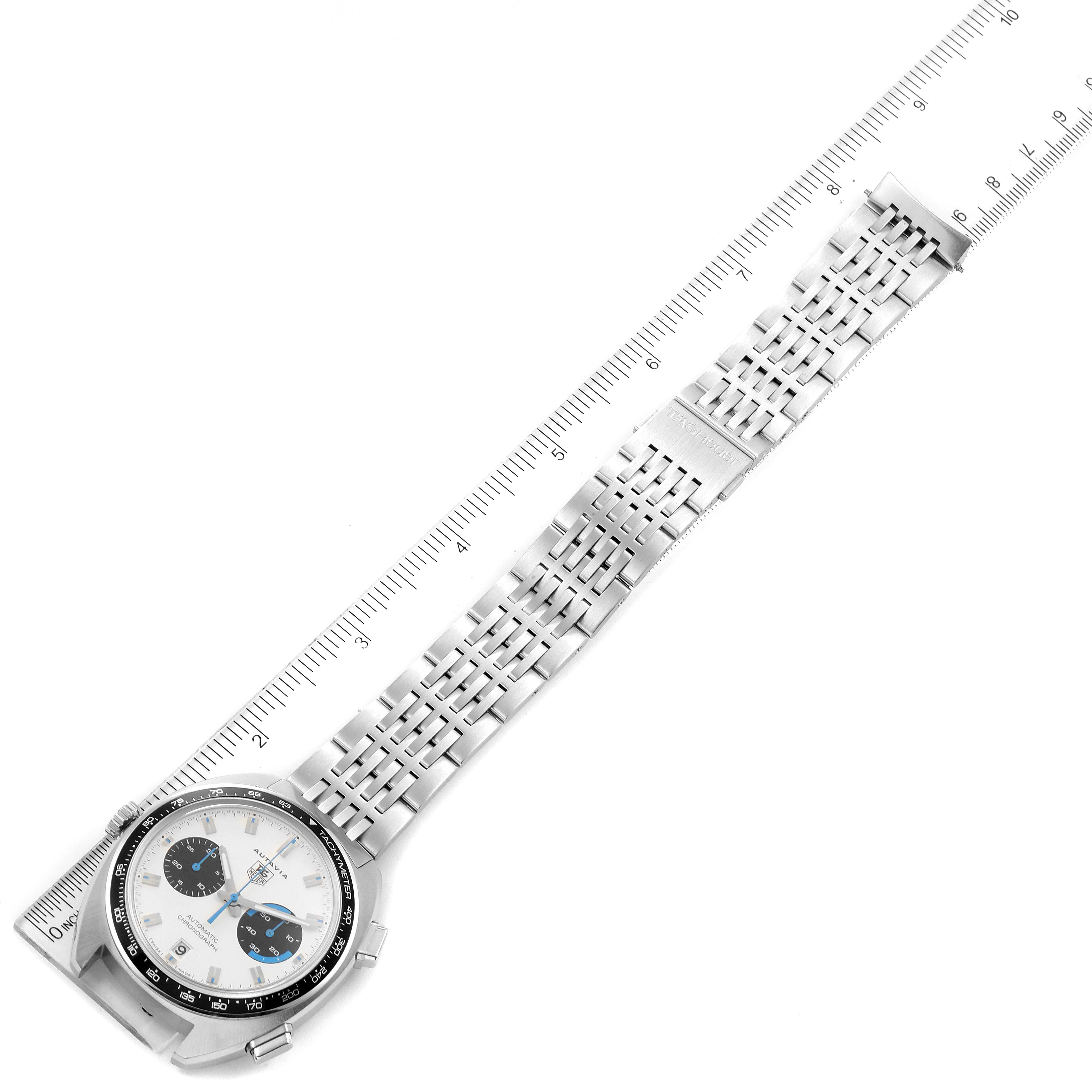 The image shows a top-down view of the Tag Heuer Autavia CY2110 Men's Stainless Steel White Dial CY2110 Men's Stainless Steel White Dial watch, including its stainless steel case, dial, and bracelet.