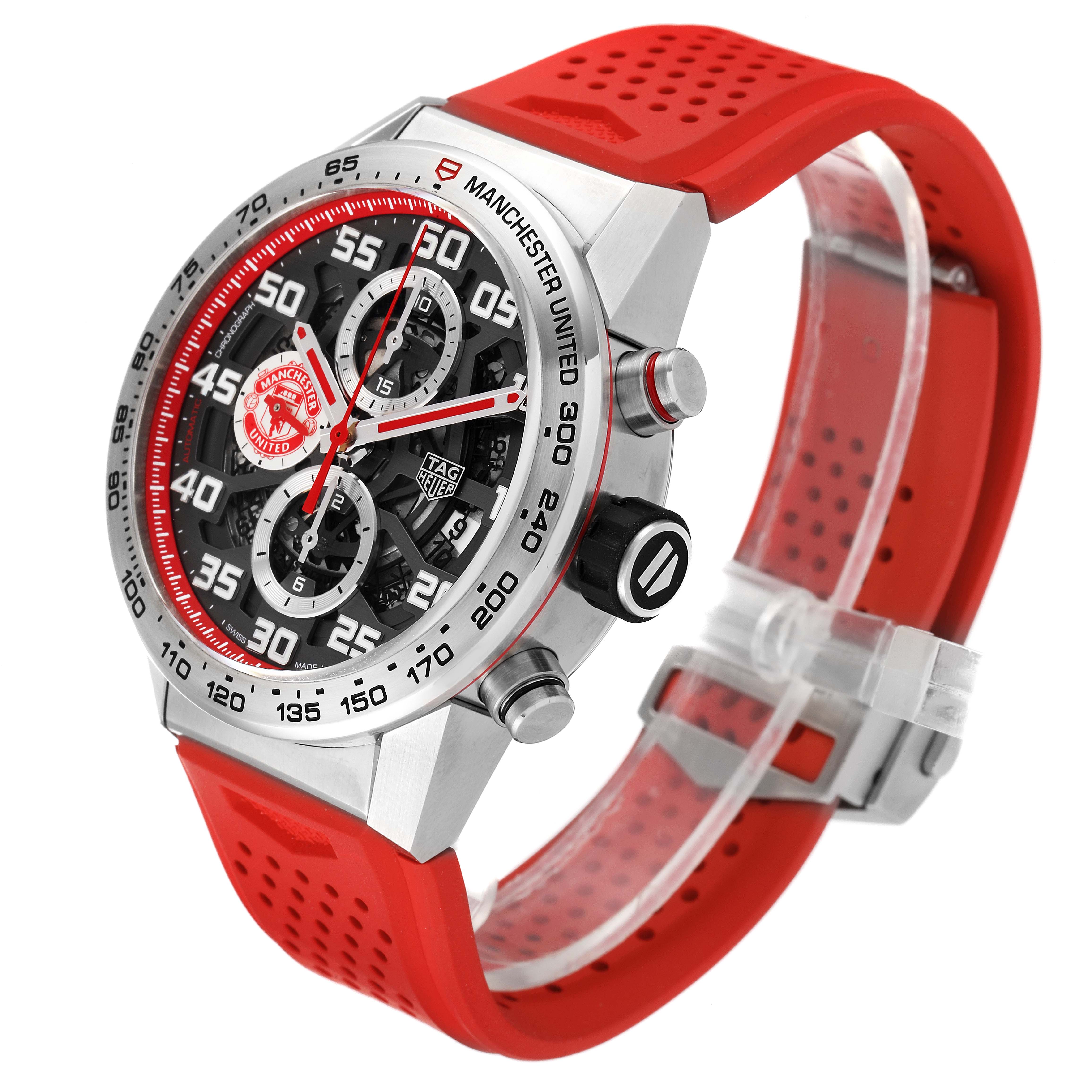 The Tag Heuer Carrera CAR201M.FT6156 Men's Stainless Steel Silver Dial CAR201M.FT6156 Men's Stainless Steel Silver Dial watch is shown at an angle showcasing the dial, bezel, crown, pushers, and a red perforated strap.