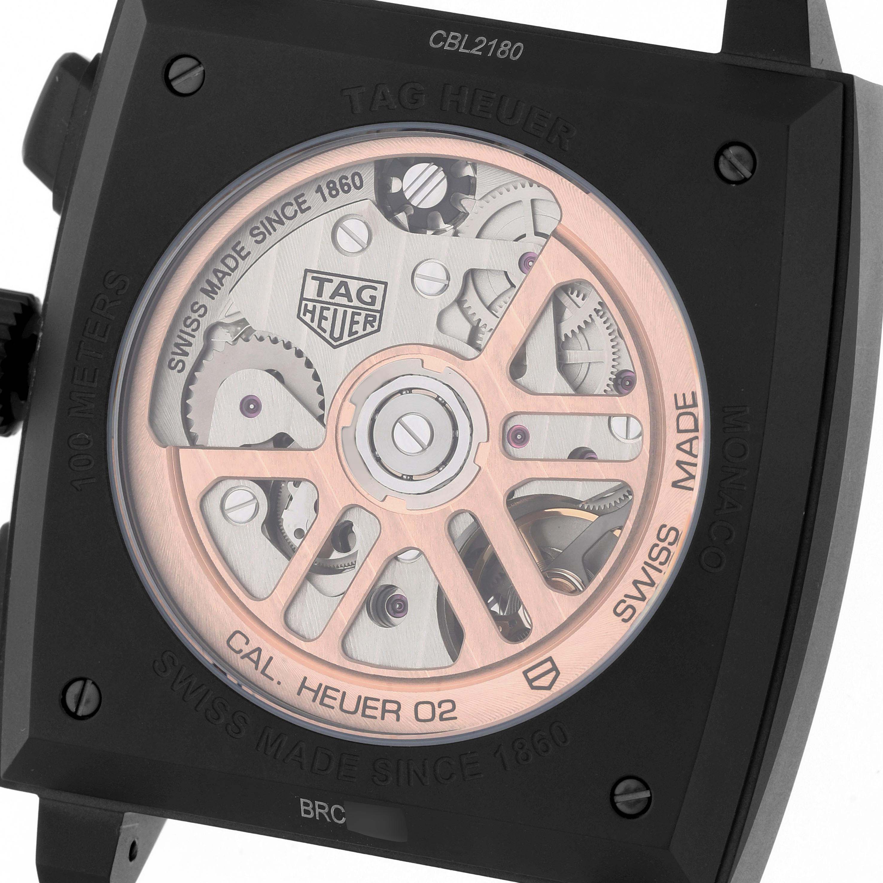 The image shows the back view of the Monaco model by Tag Heuer, highlighting its movement and rotor.