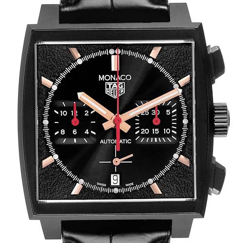 The Tag Heuer Monaco watch is shown from the front, highlighting its square face and chronograph subdials.
