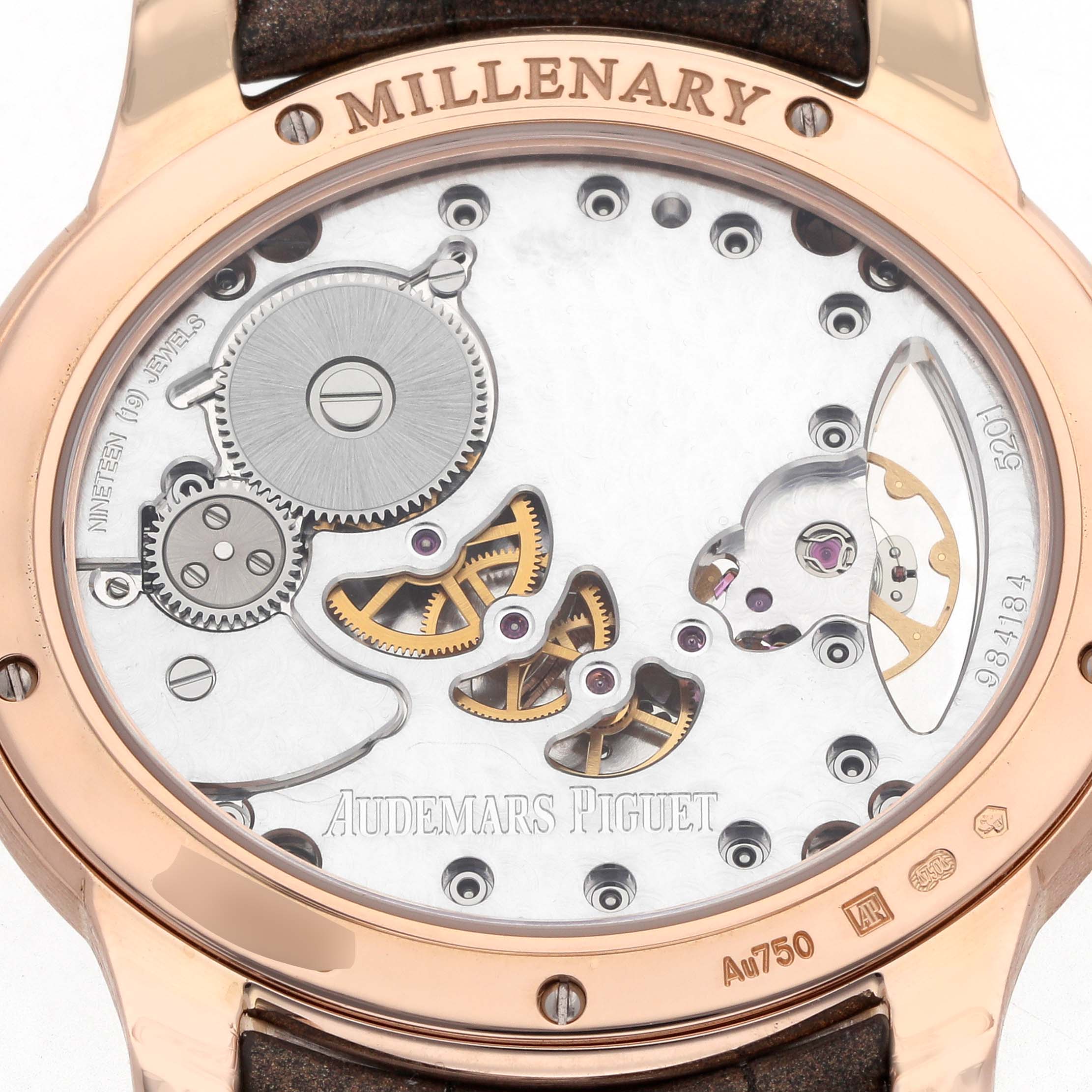 The image shows the back of the Audemars Piguet Millenary 77247OR Women
s Rose Gold Mother of Pearl Dial watch, revealing its intricate movement and engravings.