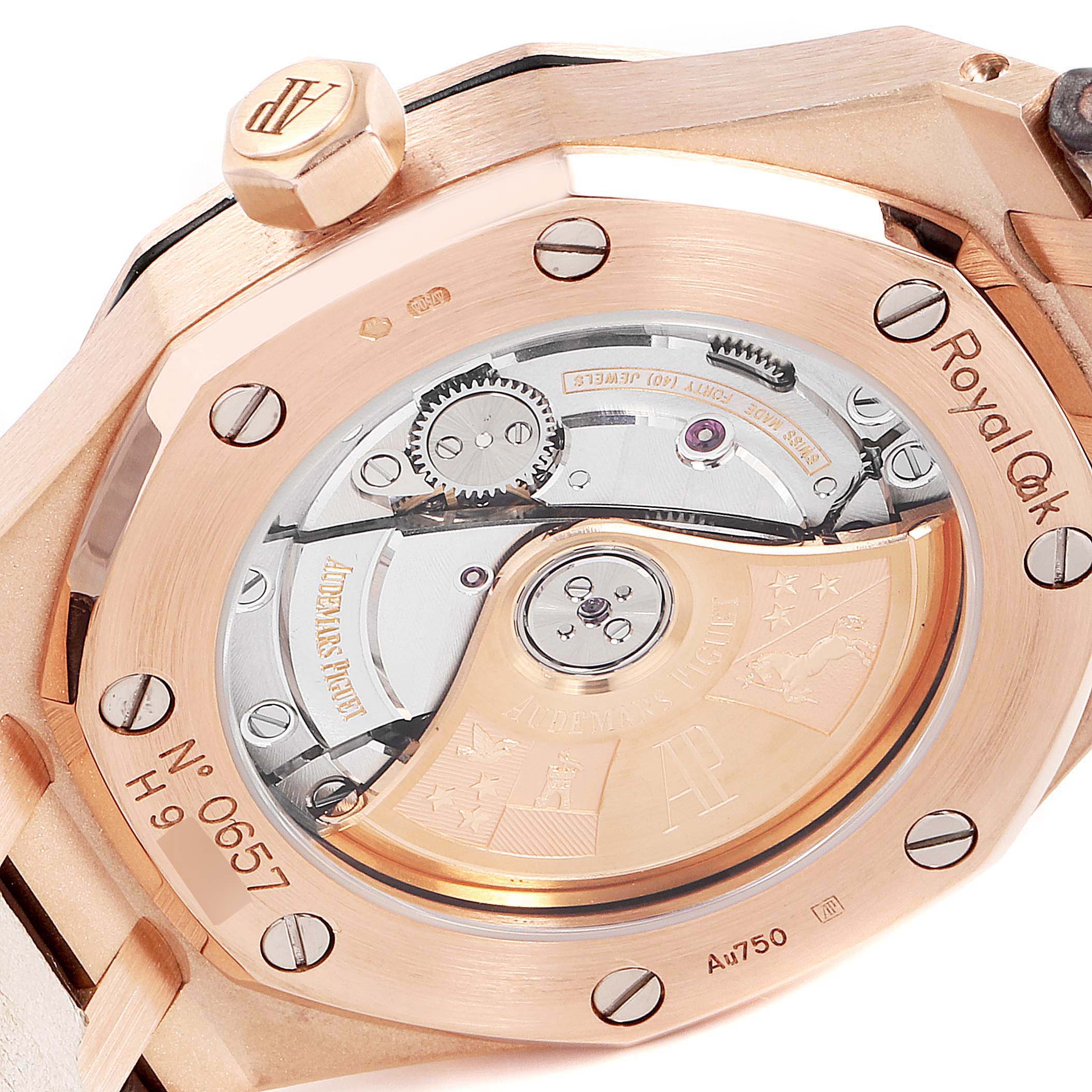 The image shows the back view of an Audemars Piguet Royal Oak 15450OR.OO.D088CR.01 Men's Rose Gold Silver Dial 15450OR.OO.D088CR.01 Men's Rose Gold Silver Dial watch, highlighting its exposed movement and engraved rotor.