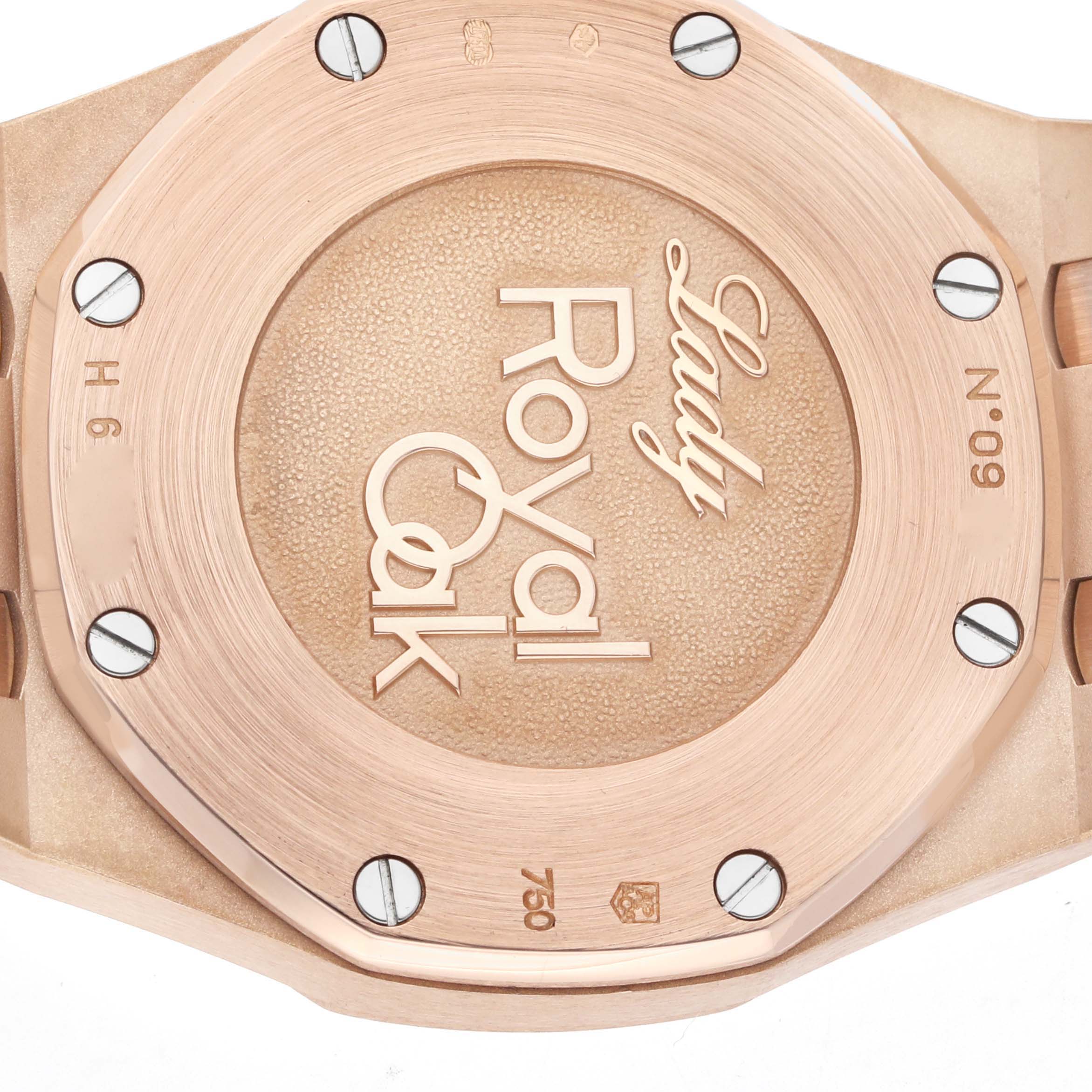 The image shows the back of an Audemars Piguet Royal Oak 77321OR Women
s Rose Gold Brown Dial watch, highlighting the case back with engravings.
