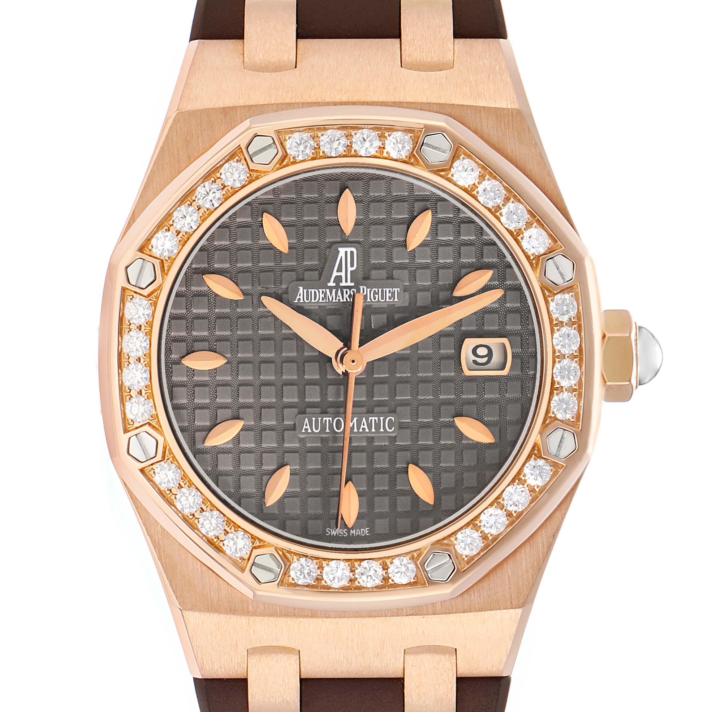 The image shows a Royal Oak by Audemars Piguet from a frontal angle, highlighting the diamond bezel, dial, and date window.