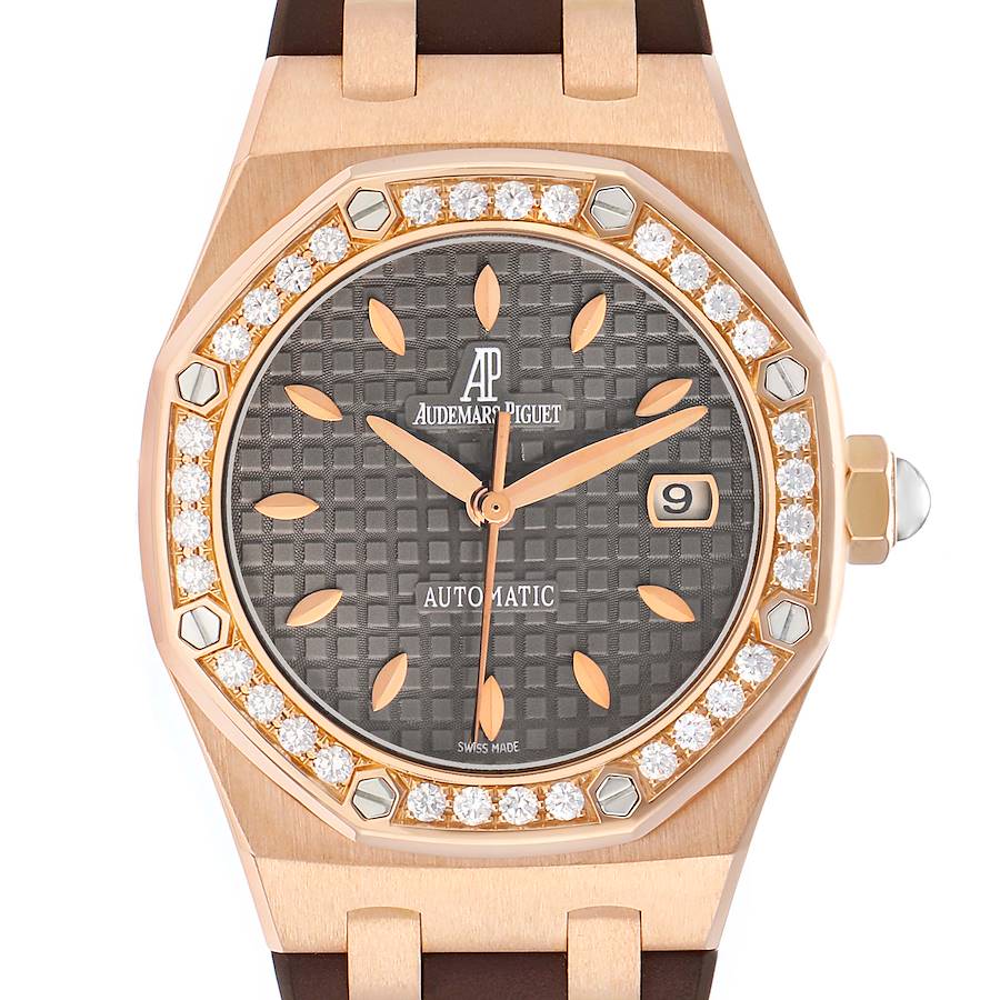 The image shows a Royal Oak by Audemars Piguet from a frontal angle, highlighting the diamond bezel, dial, and date window.