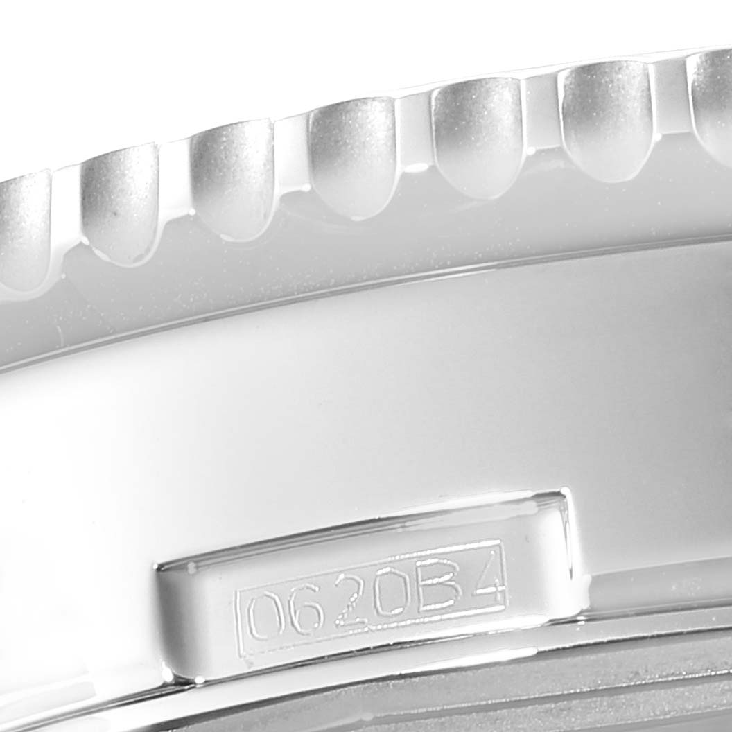 This close-up shows the serial number and the knurled bezel edge of a Breitling Navitimer AB0127-211-B1A1 Men
s Stainless Steel Black Dial AB0127-211-B1A1 Men
s Stainless Steel Black Dial watch.