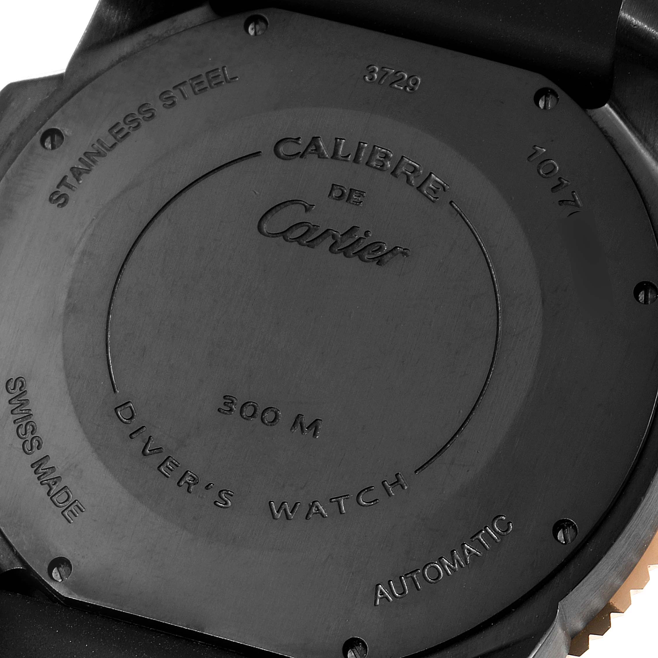 The image shows the back case of a Calibre de Cartier watch by Cartier, displaying engravings and specifications.