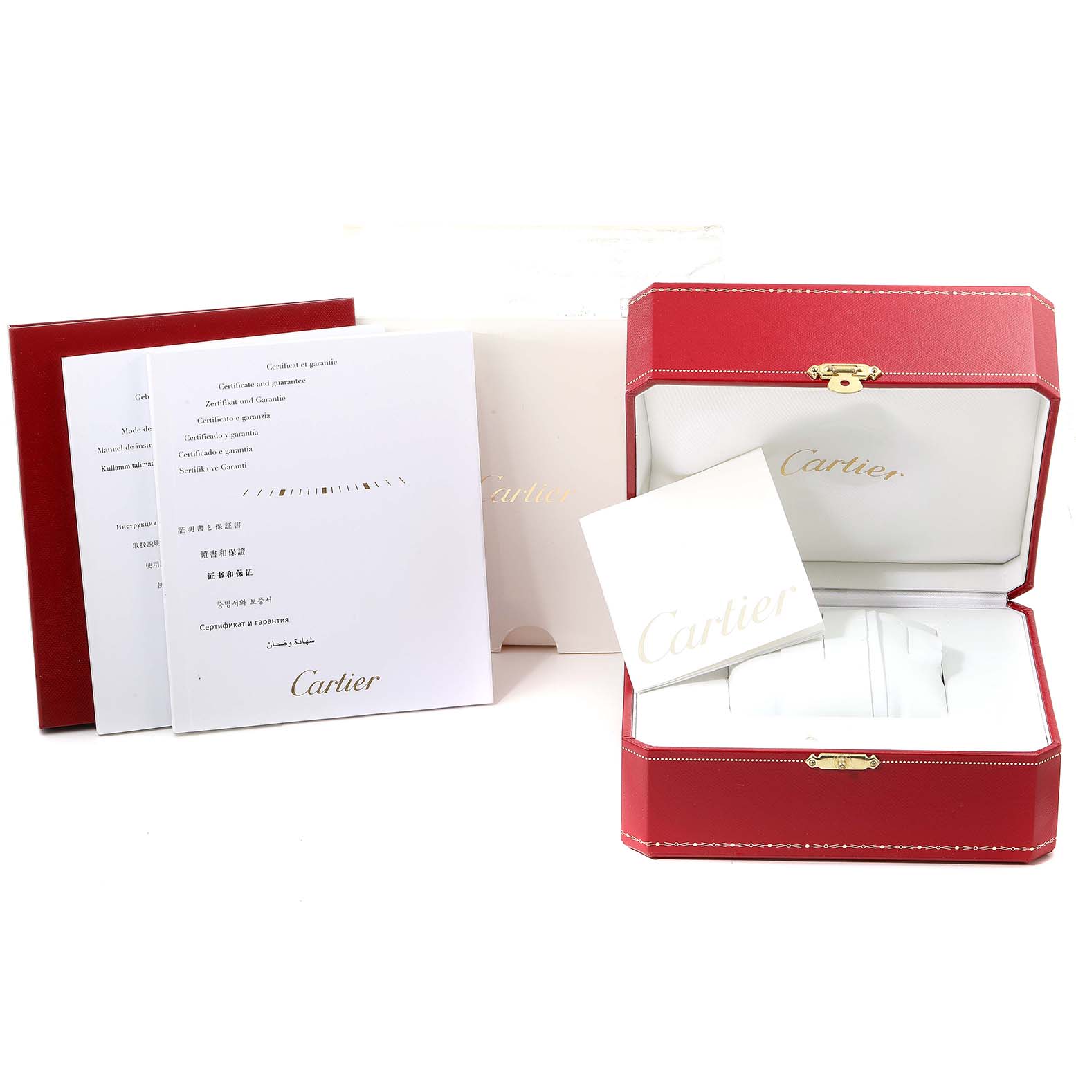 The image shows the box and documents for a Calibre de Cartier watch by Cartier, including manuals, a certificate, and a red watch box.