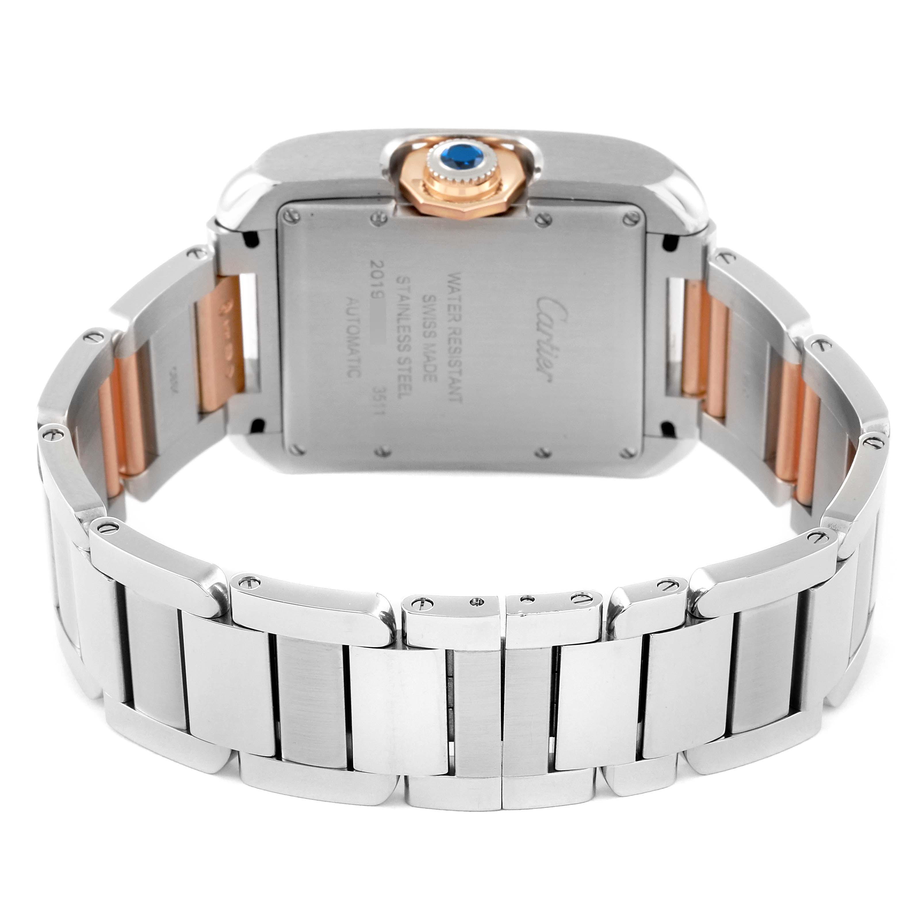 This image shows the back view of the Cartier Tank Anglaise W5310037 Men
s Steel and Gold (two tone) Silver Dial W5310037 Men
s Steel and Gold (two tone) Silver Dial watch, highlighting its stainless steel case, bracelet, and crown with a blue gem.