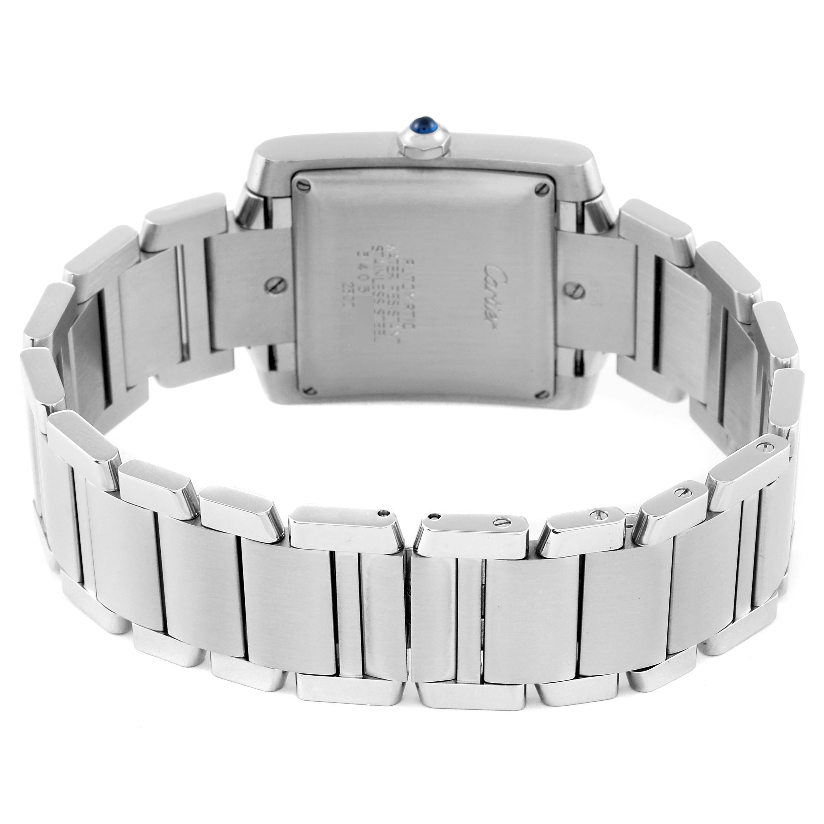 The image shows the back view of a Cartier Tank Francaise W51002Q3 Men
s Stainless Steel Silver Dial W51002Q3 Men
s Stainless Steel Silver Dial watch with its stainless steel bracelet.