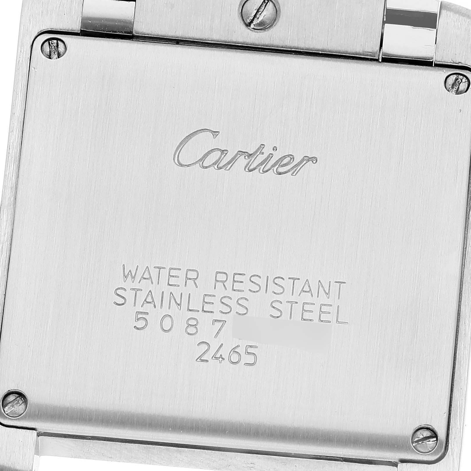 The image shows the back case of a Cartier Tank Francaise W51011Q3 Women's Stainless Steel Silver Dial W51011Q3 Women's Stainless Steel Silver Dial watch, featuring engraved text and screws.
