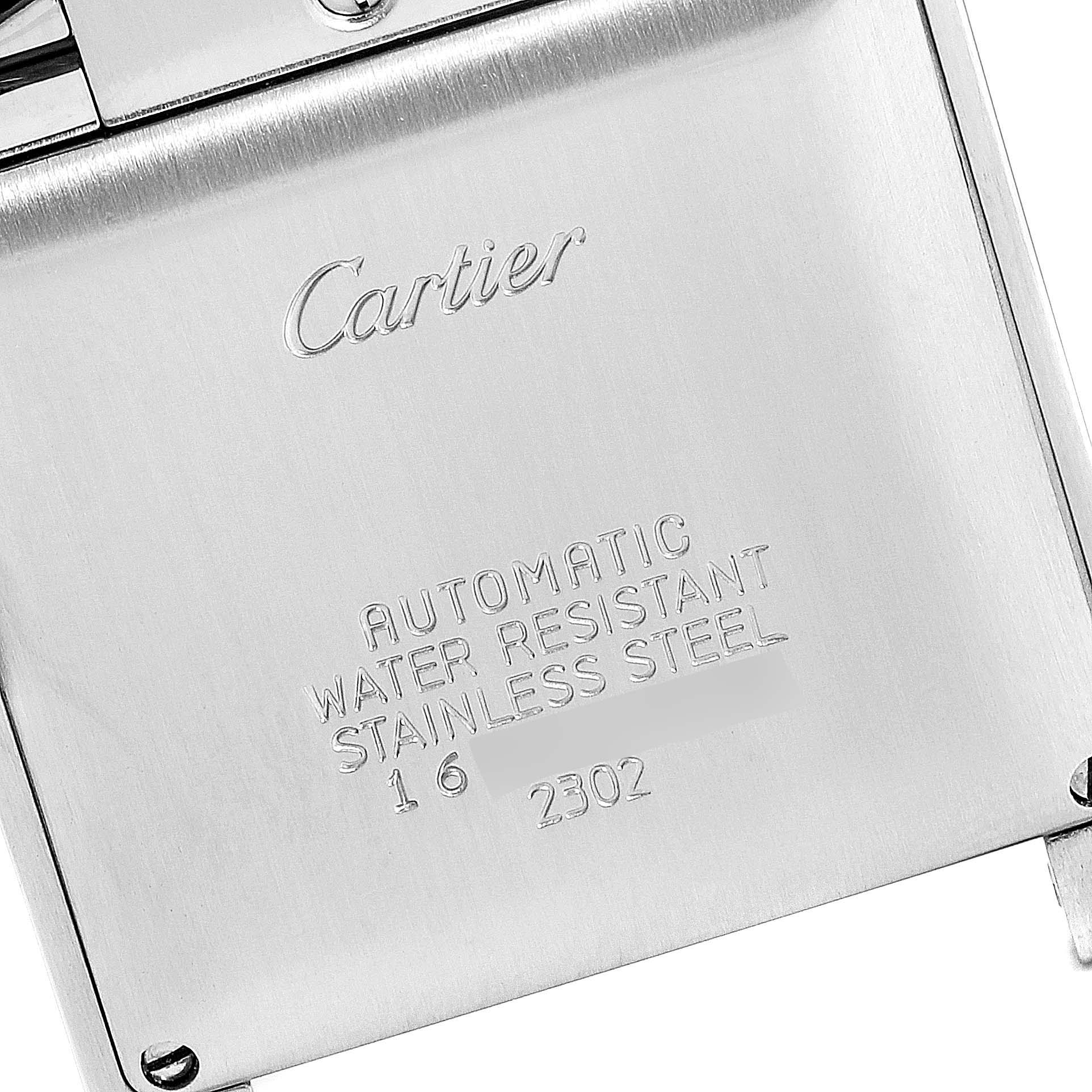 This image shows the back of a Cartier Tank Française watch, displaying engraved details like branding and specifications.