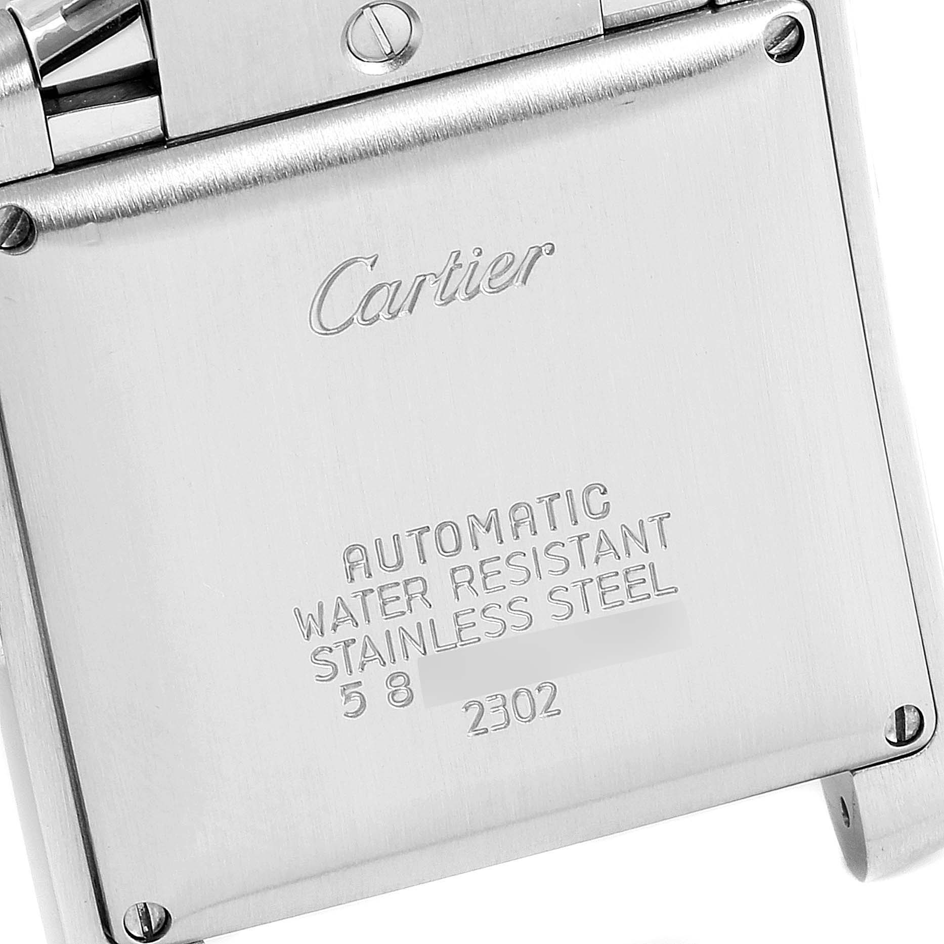 The image shows the back case and engravings of a Cartier Tank Française watch.