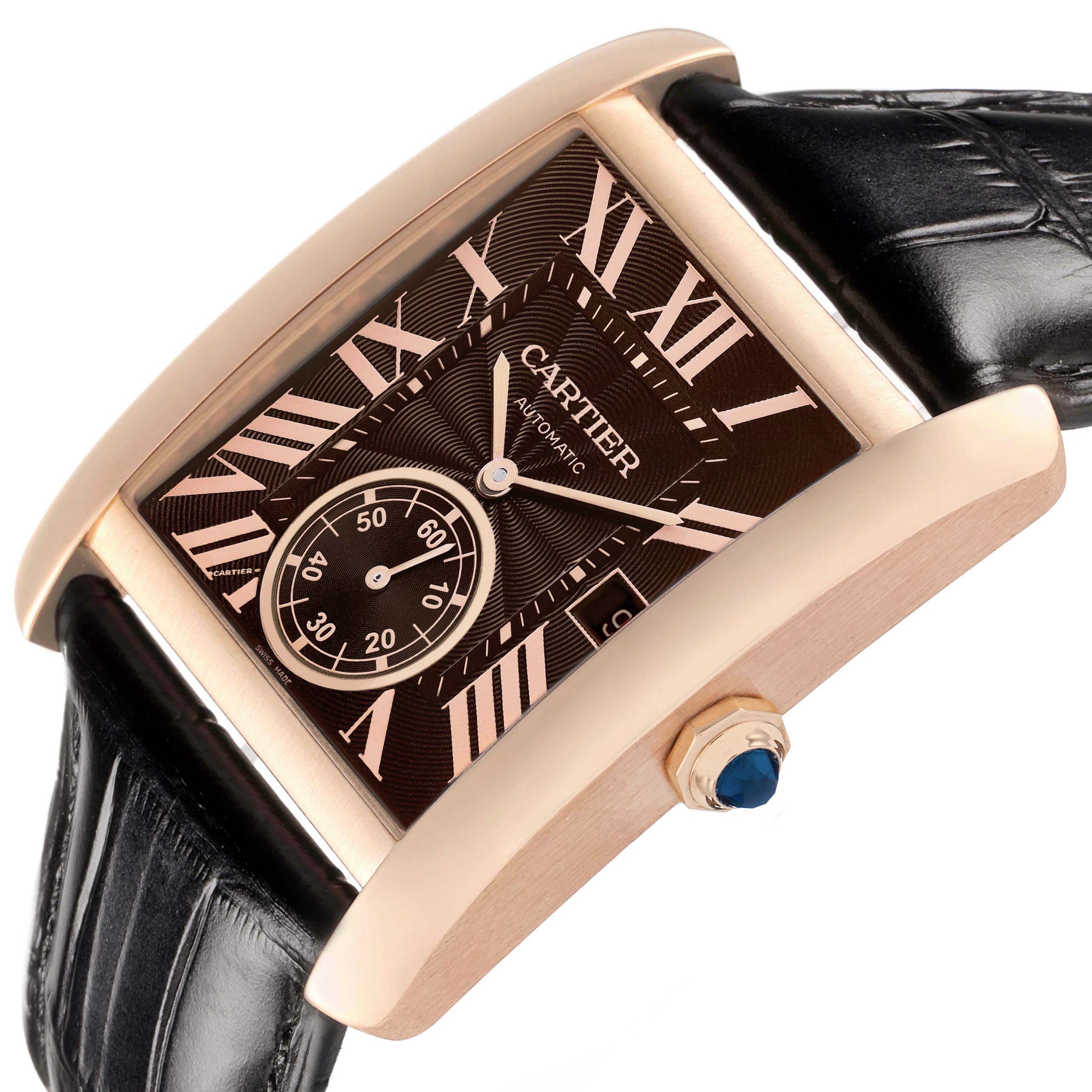 The Cartier Tank MC W5330002 Men's Rose Gold Brown Dial watch is shown at an angle highlighting the face, side, leather strap, and crown with a blue gemstone.