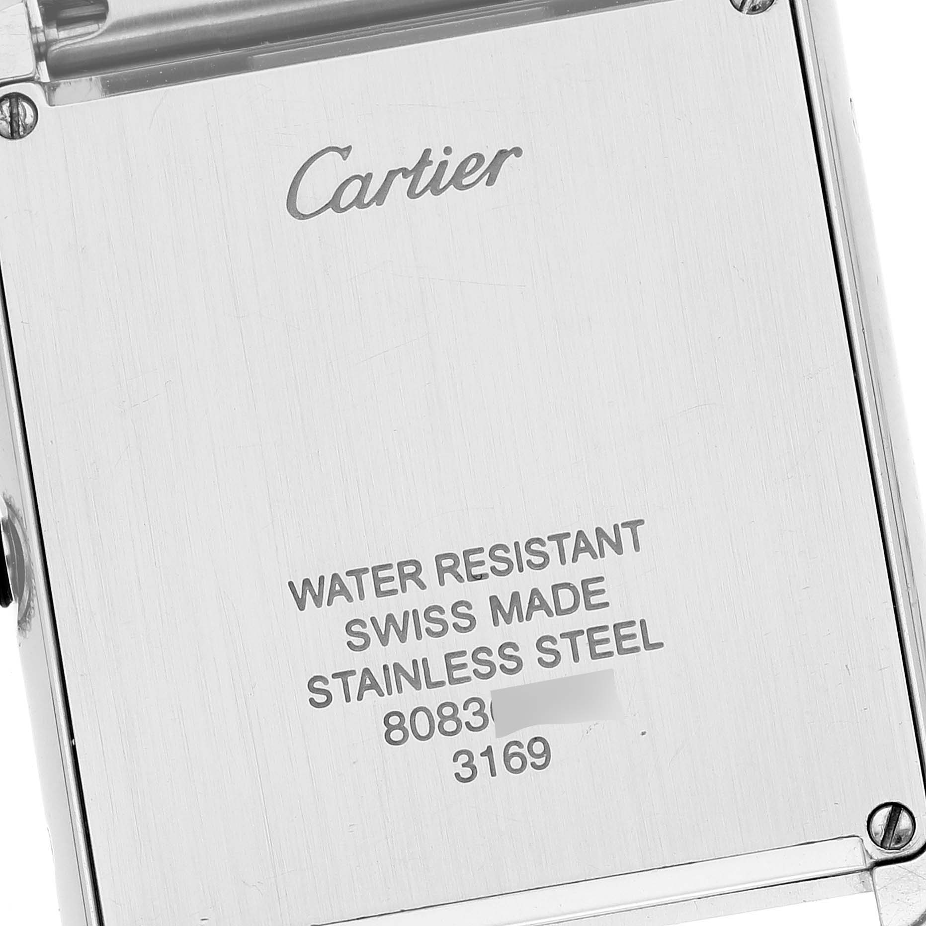 The image shows the back case of a Cartier Tank Solo W5200014 Men
s Stainless Steel Silver Dial W5200014 Men
s Stainless Steel Silver Dial watch, displaying "Cartier" and specifications like water resistance and material.