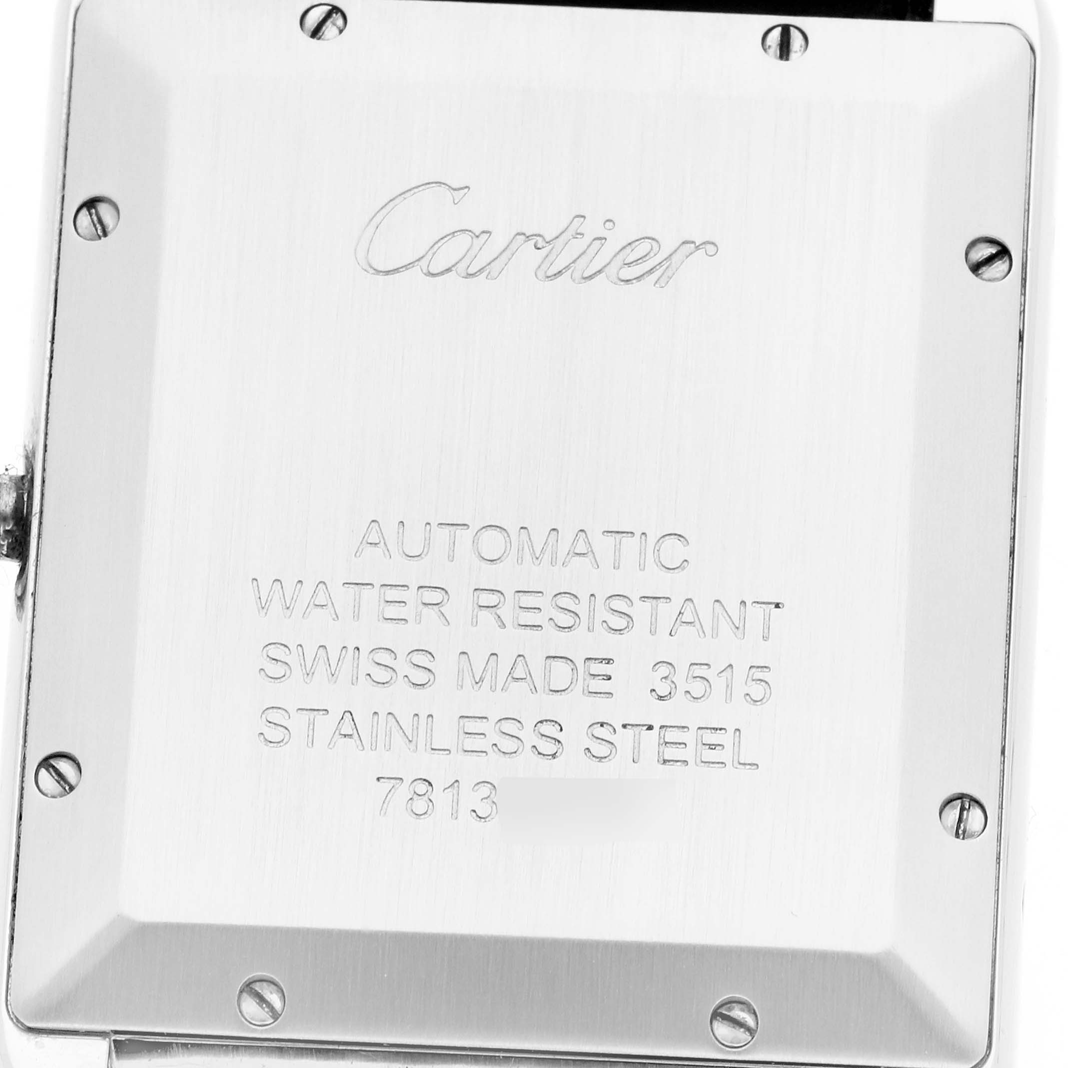 The image shows the back of the Cartier Tank Solo W5200027 Men
s Stainless Steel Silver Dial watch, featuring engravings and screws on the stainless steel case.