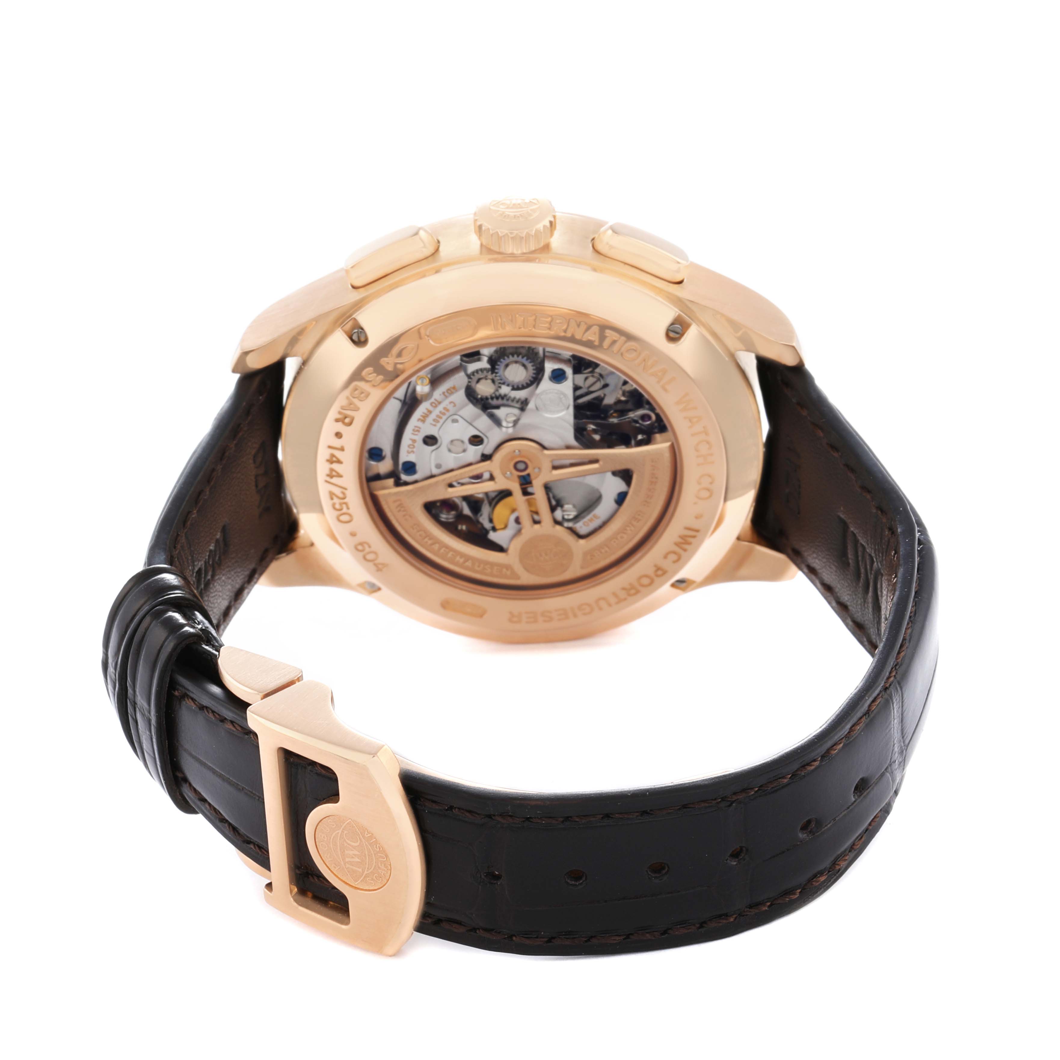 The image shows the back view of an IWC Portuguese IW397204 Men
s Rose Gold Blue Dial watch, highlighting its transparent case back and leather strap.