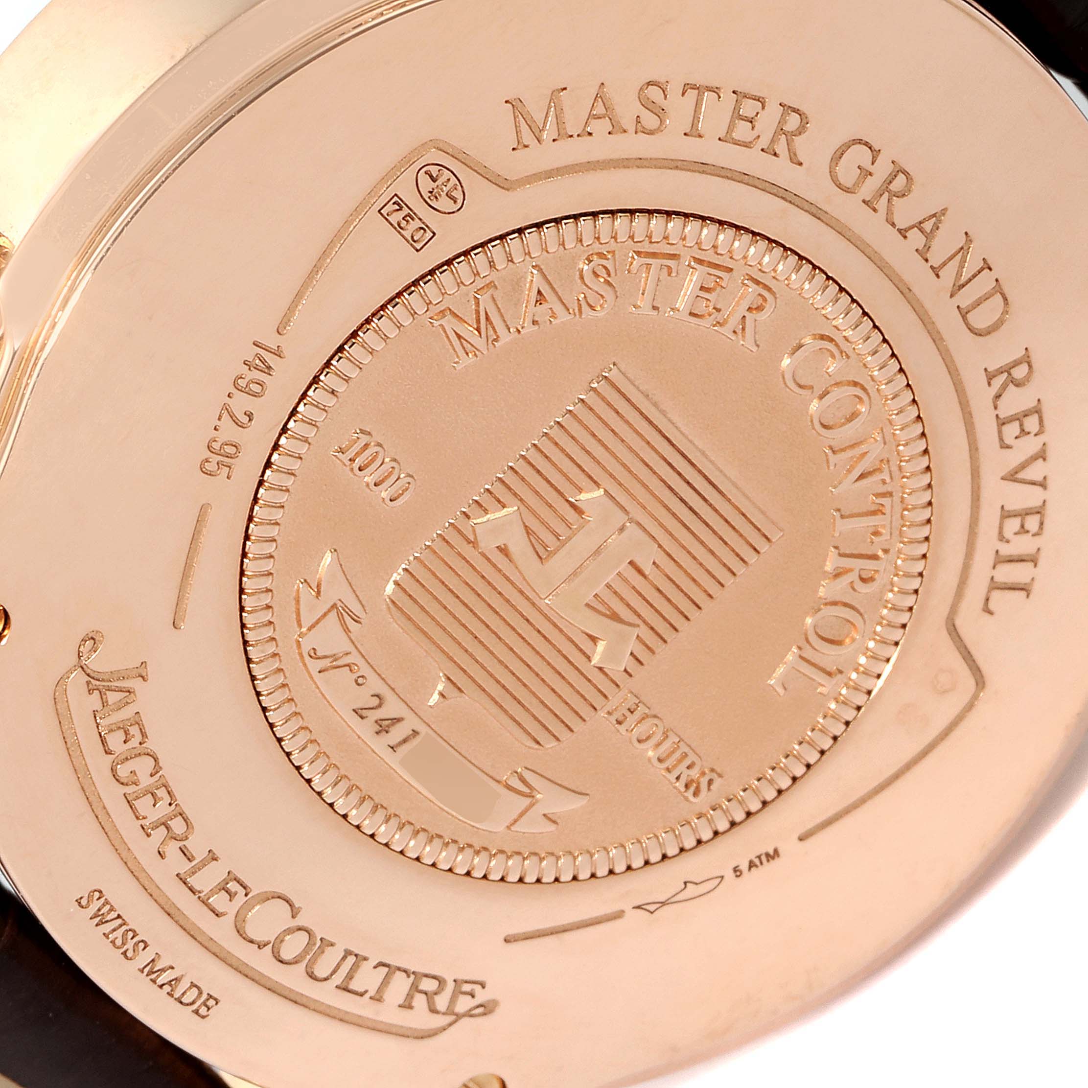 The image shows the case back of a Jaeger-LeCoultre Master Grand Reveil watch, highlighting the engravings and model details.