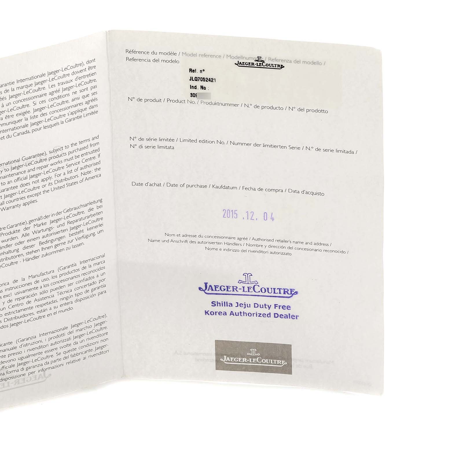 The image shows an open Jaeger-LeCoultre Reverso warranty card from an angle, displaying text and logos.