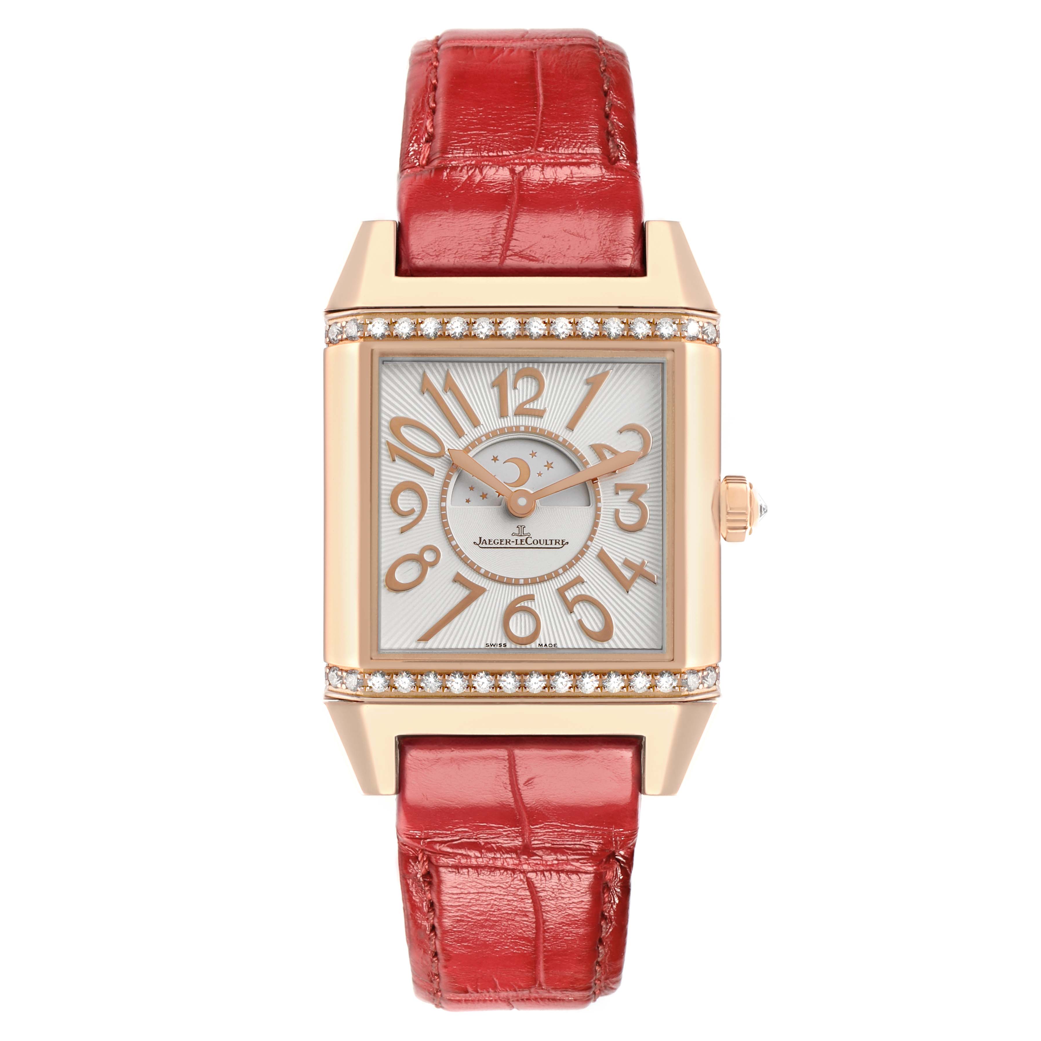 The Jaeger-LeCoultre Reverso watch is shown from the front, featuring a red leather strap, a diamond-set rectangular case, and an intricate dial.