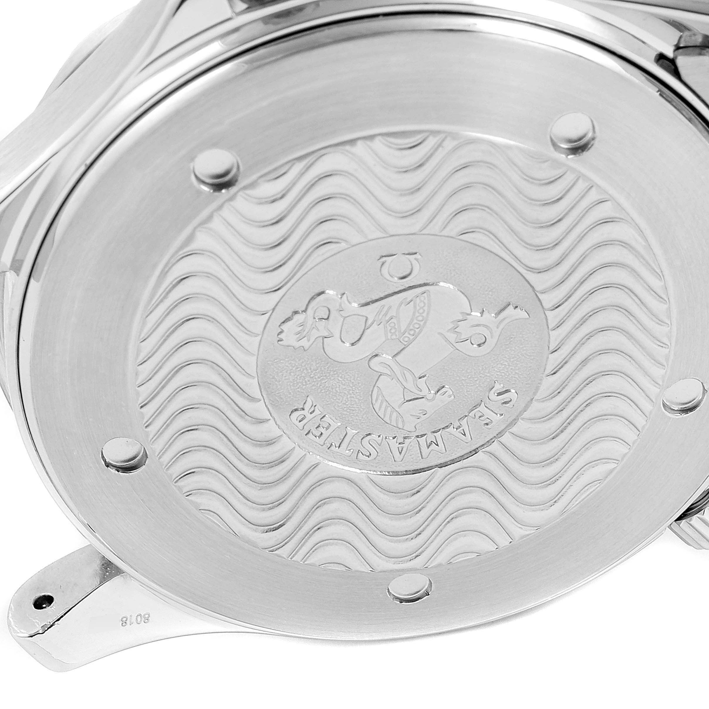 This image shows the case back of an Omega Seamaster 2254.50.00 Men
s Stainless Steel Black Dial 2254.50.00 Men
s Stainless Steel Black Dial watch, featuring an embossed wave pattern and logo.