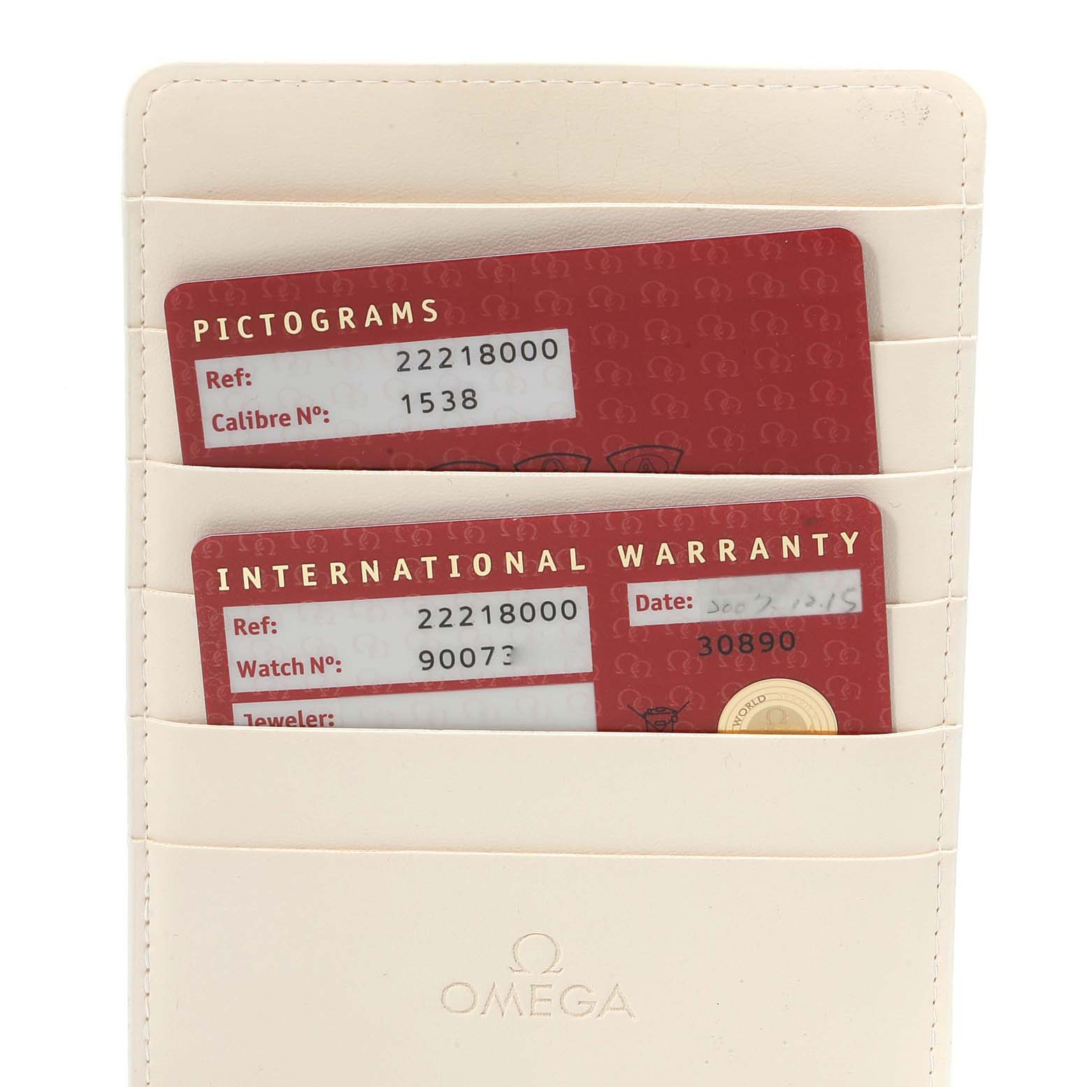 The image shows Omega Seamaster 2221.80.00 Men's Stainless Steel Blue Dial 2221.80.00 Men's Stainless Steel Blue Dial model's warranty cards in a white Omega cardholder, capturing a frontal view.