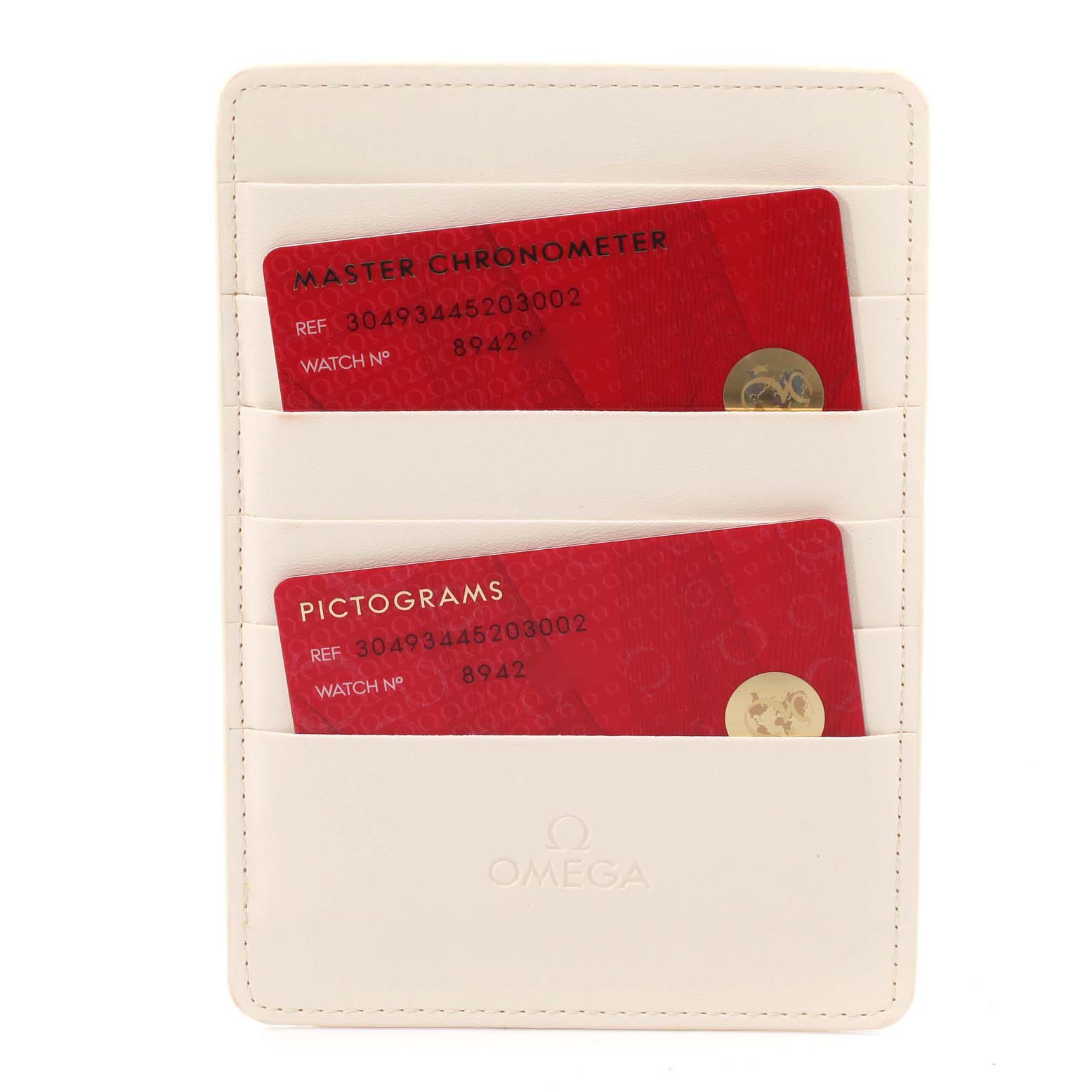 The image shows two red certification cards in a white Omega card holder for the Omega Speedmaster 304.93.44.52.03.002 Men's Ceramic Blue Dial 304.93.44.52.03.002 Men's Ceramic Blue Dial.