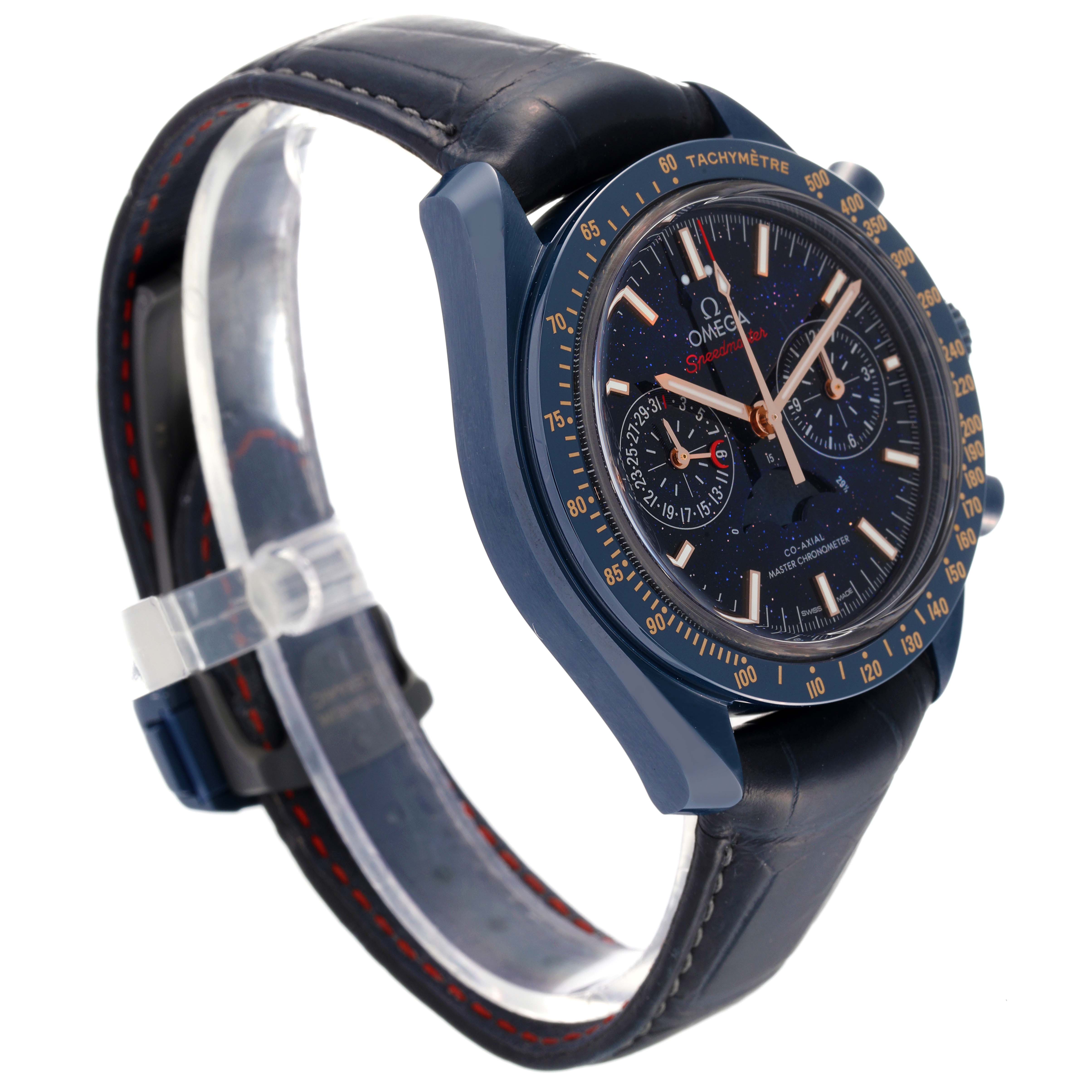 The Omega Speedmaster 304.93.44.52.03.002 Men's Ceramic Blue Dial 304.93.44.52.03.002 Men's Ceramic Blue Dial watch is shown at a slight angle, displaying the dial, case, bezel, and a part of the leather strap.