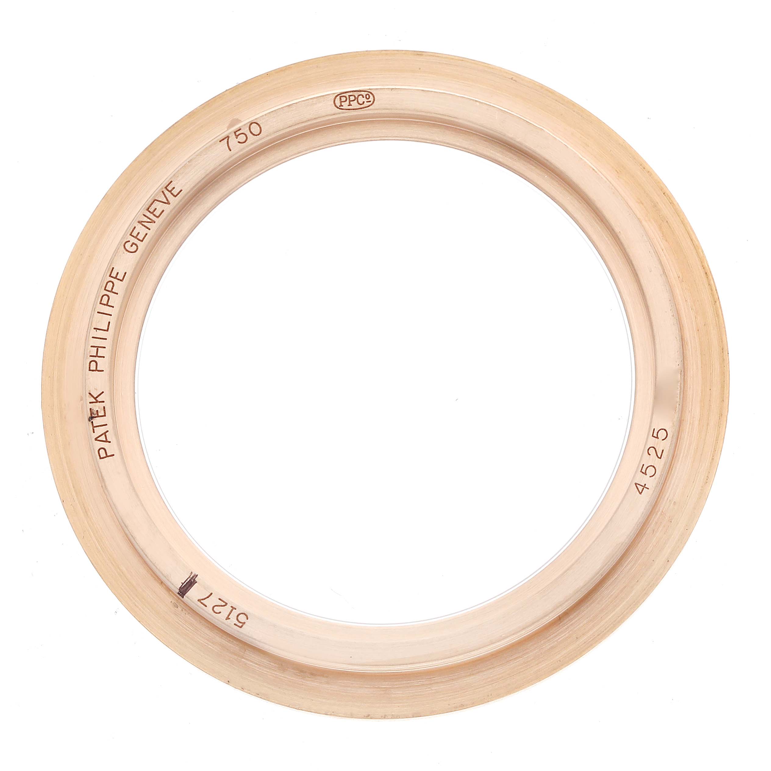 This image shows a Patek Philippe Calatrava 5127R Men
s Rose Gold Silver Dial watch bezel from a top view, displaying engravings and branding details.