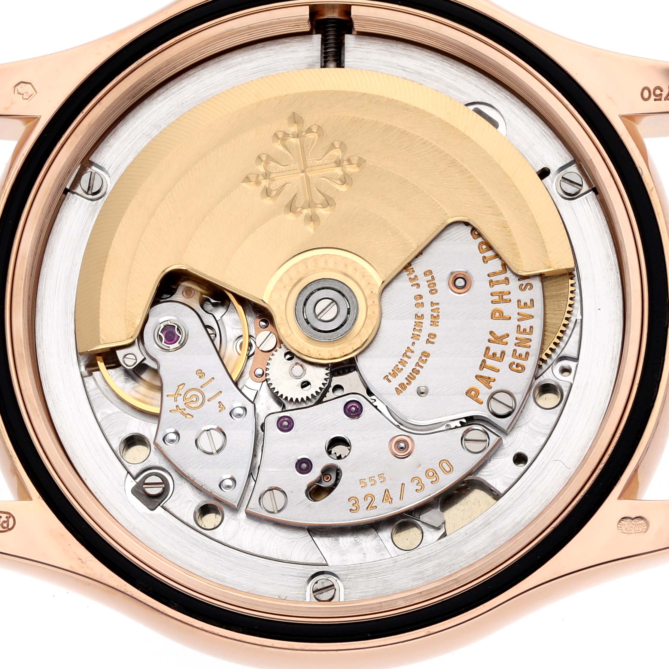 This image shows the movement and rotor of a Patek Philippe Calatrava 5127R Men
s Rose Gold Silver Dial watch from the back view.
