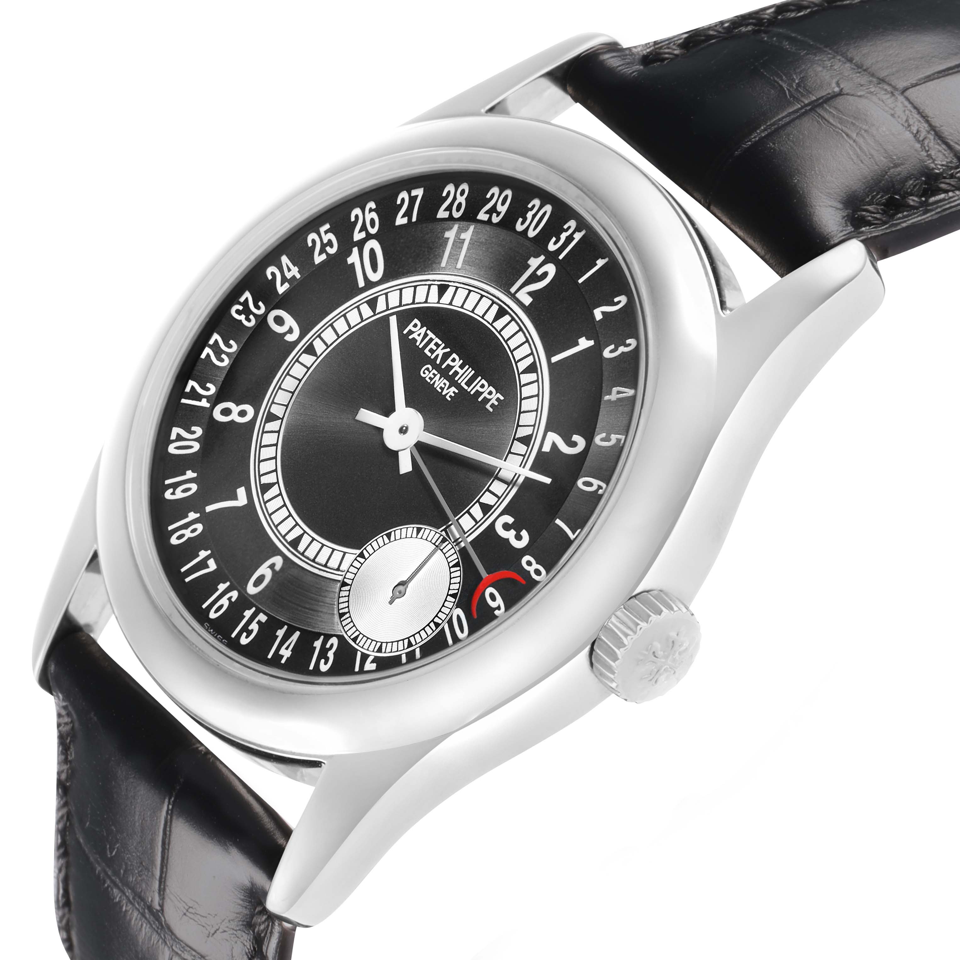 The Patek Philippe Calatrava 6000G Men
s White Gold Grey Dial watch is shown from a side angle, highlighting the crown, dial, and leather strap.