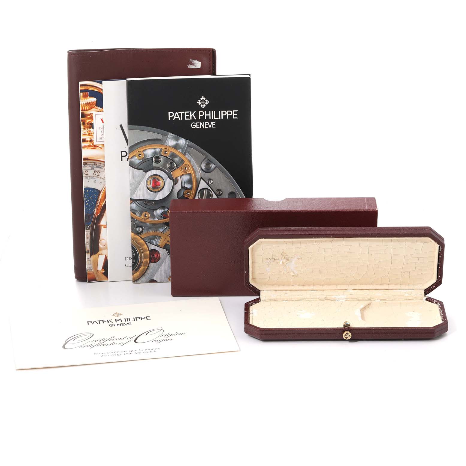 The image shows the box, papers, and certificate for a Patek Philippe Calatrava 5000J Men's Yellow Gold Black Dial 5000J Men's Yellow Gold Black Dial watch from a front angle.