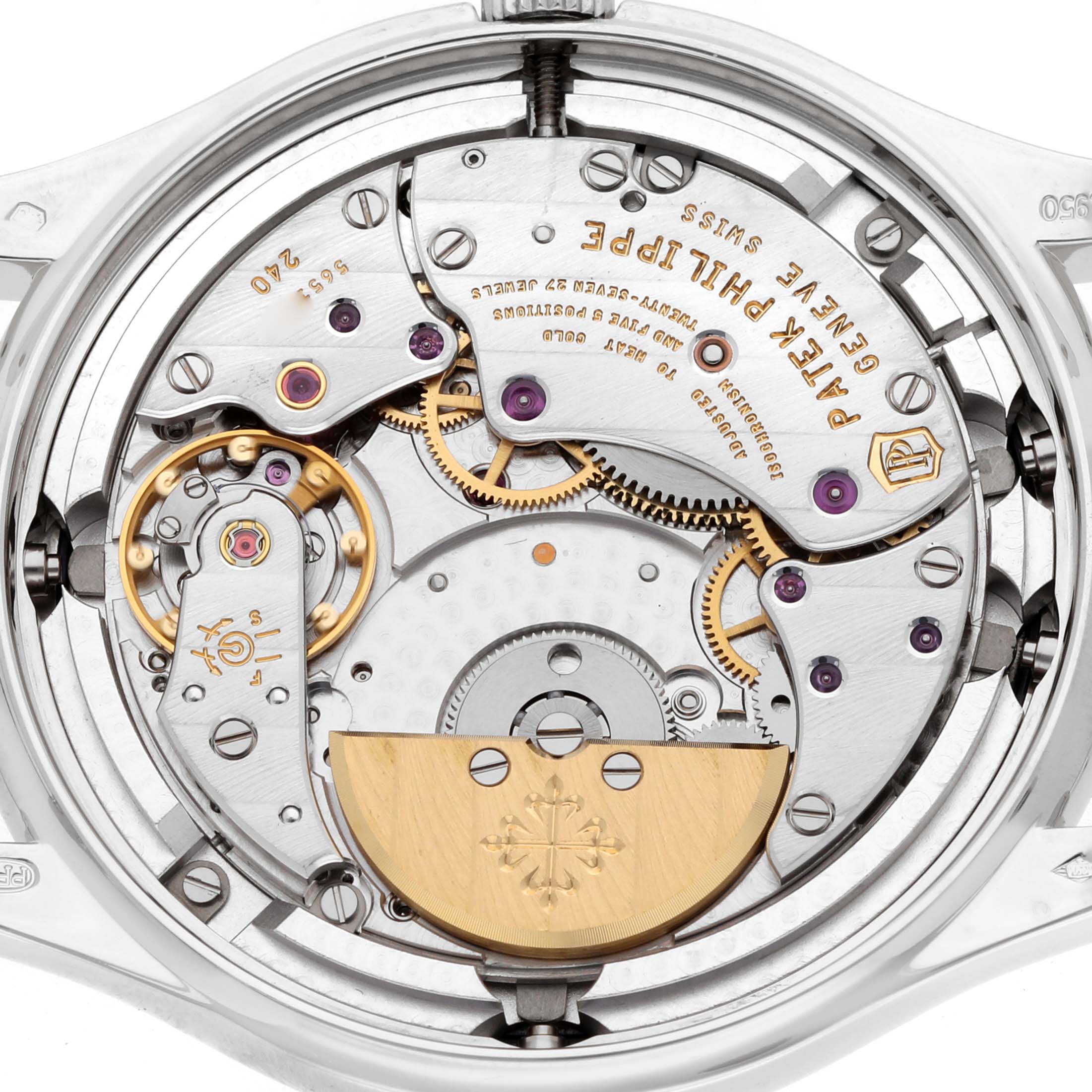 The image shows the intricate back view of the movement of a Patek Philippe Complications 5140P Men
s Platinum Blue Dial watch, highlighting gears and engravings.