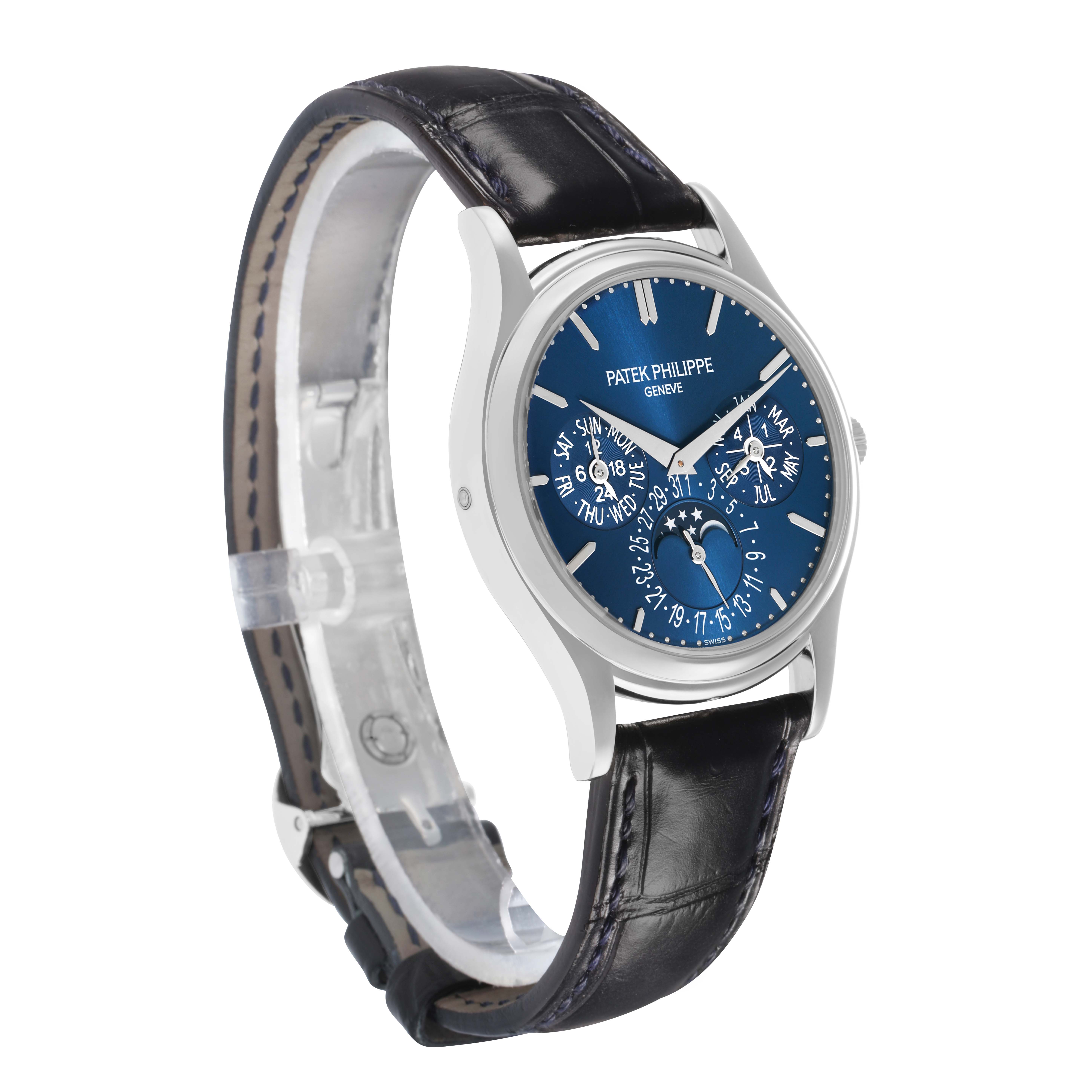 The Patek Philippe Complications 5140P Men
s Platinum Blue Dial watch is shown at a three-quarter angle, highlighting the blue dial and leather strap.