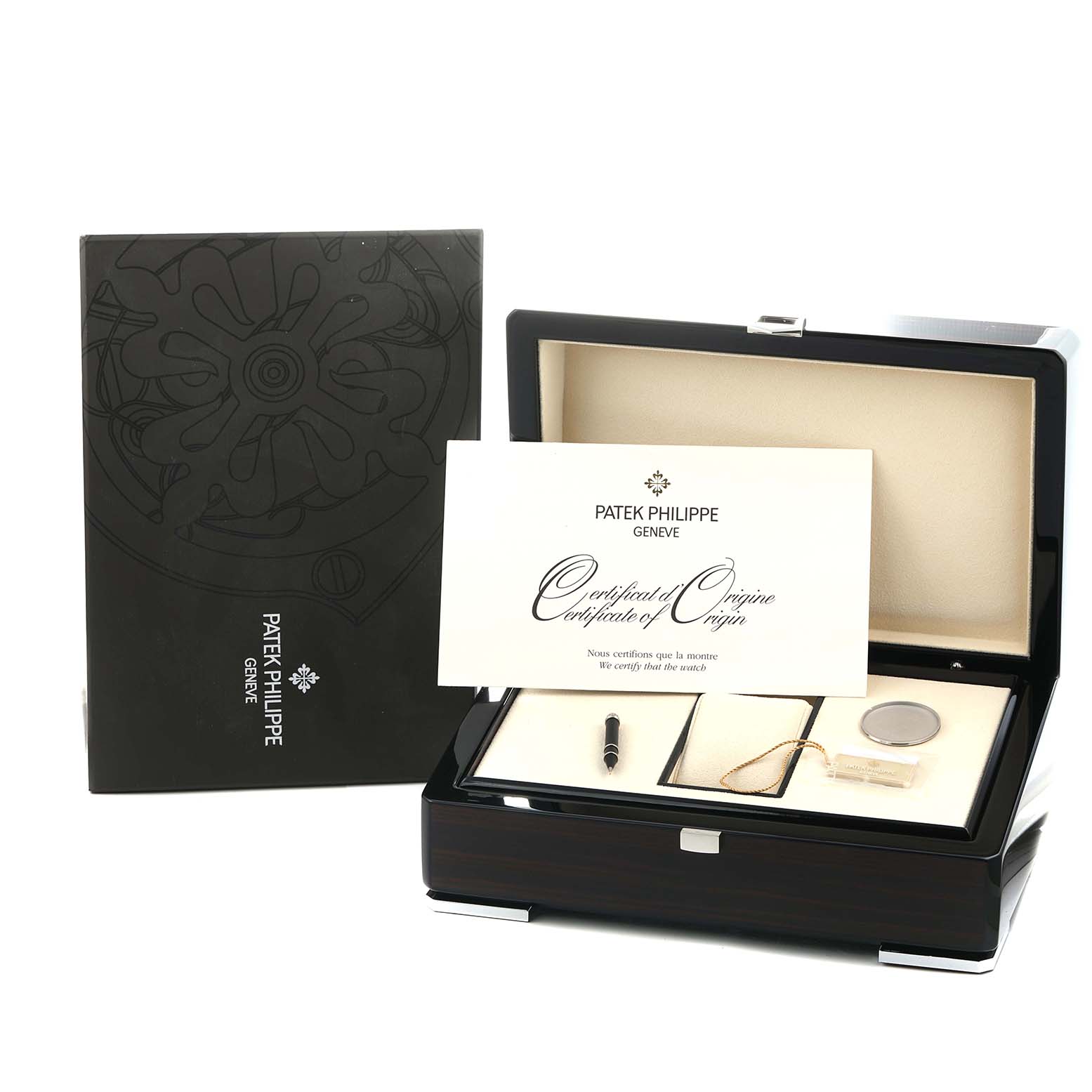 The image shows a Patek Philippe Complications 5140P Men
s Platinum Blue Dial model box with accessories, including a certificate, stylus, and tag, viewed from the front.