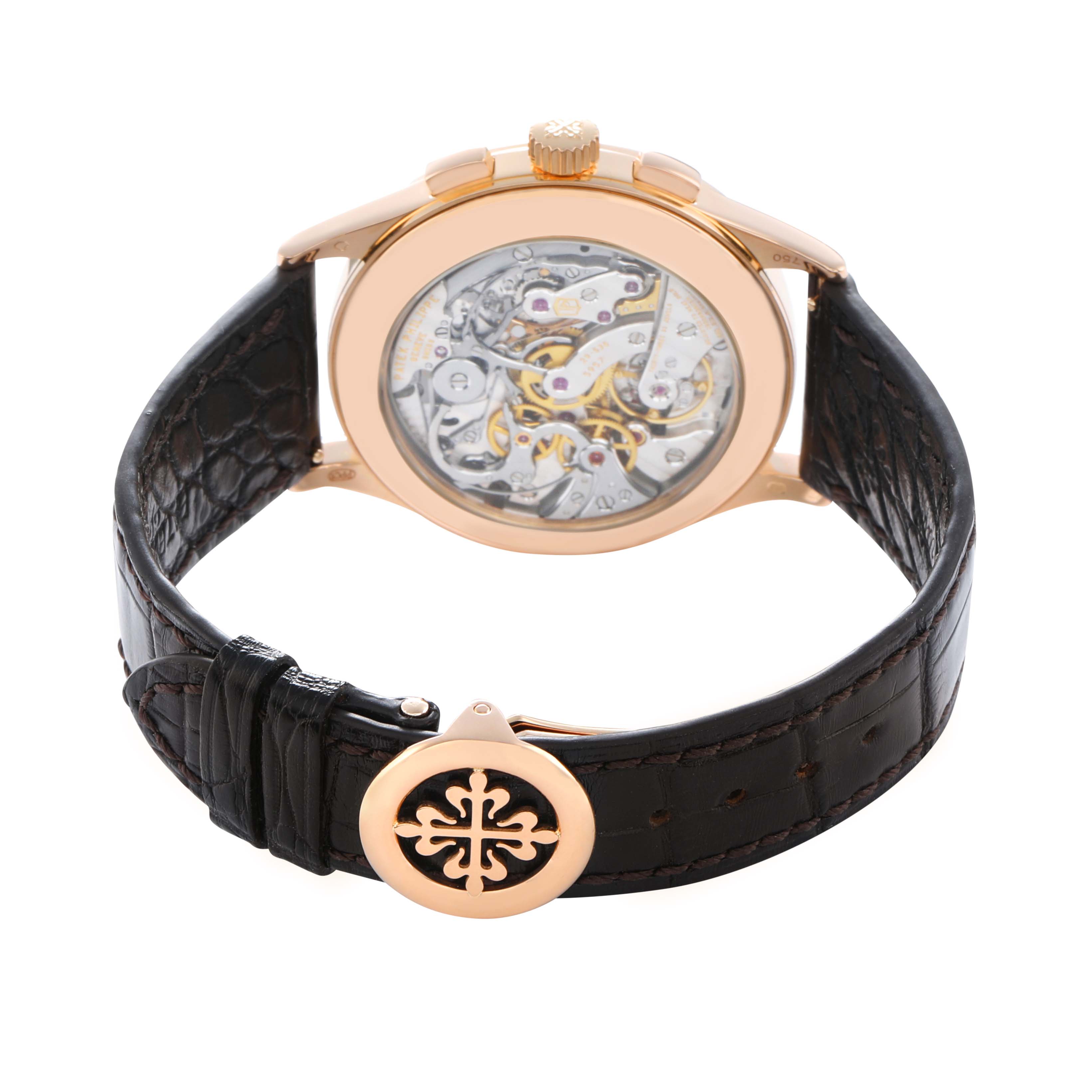 The image shows the back view of a Patek Philippe Complications 5170R Men
s Rose Gold Silver Dial watch, highlighting its transparent case back and intricate movement.